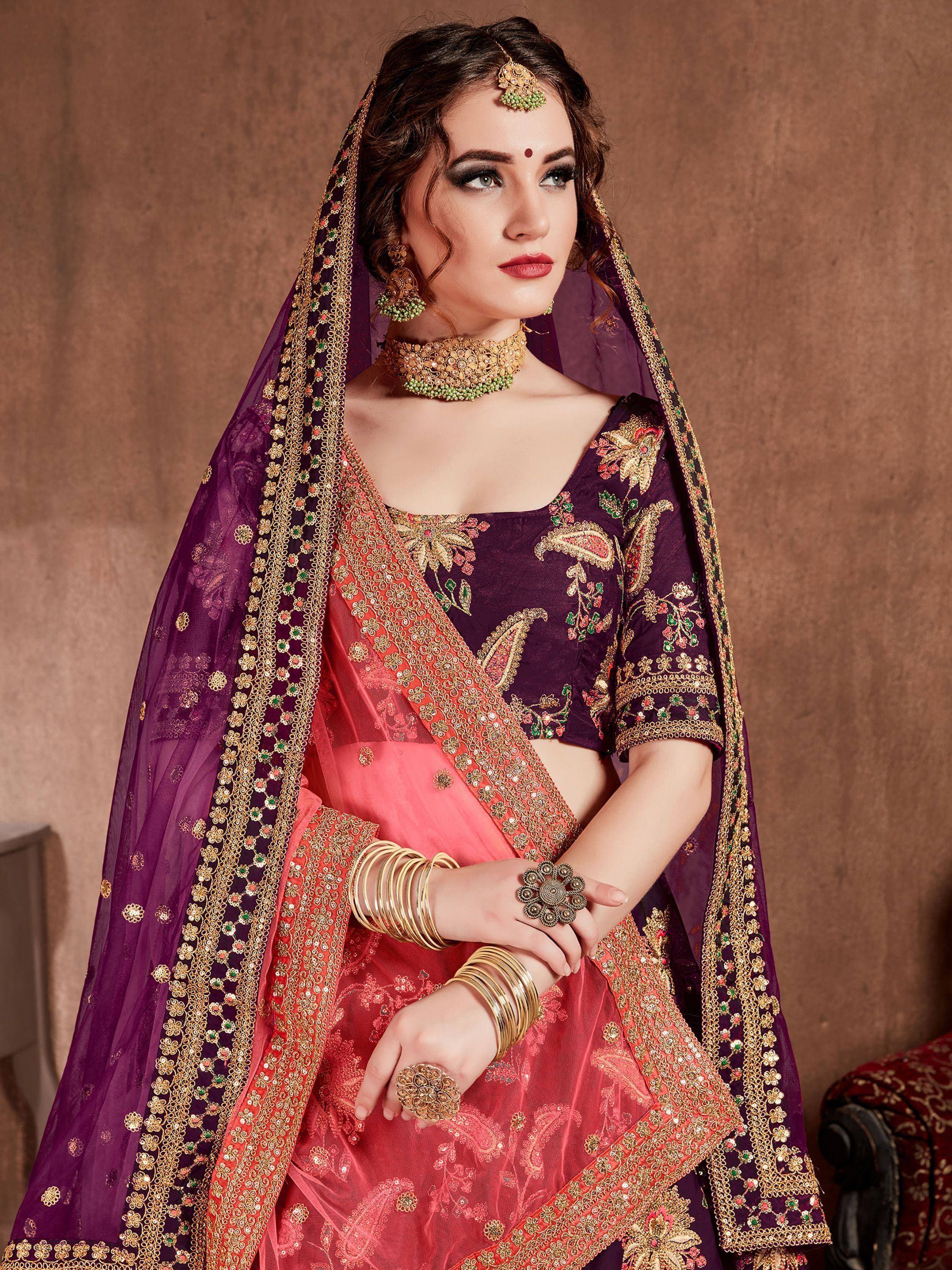 Elegant purple and pink embroidered lehenga choli with gold detailing and matching dupatta for Indian weddings