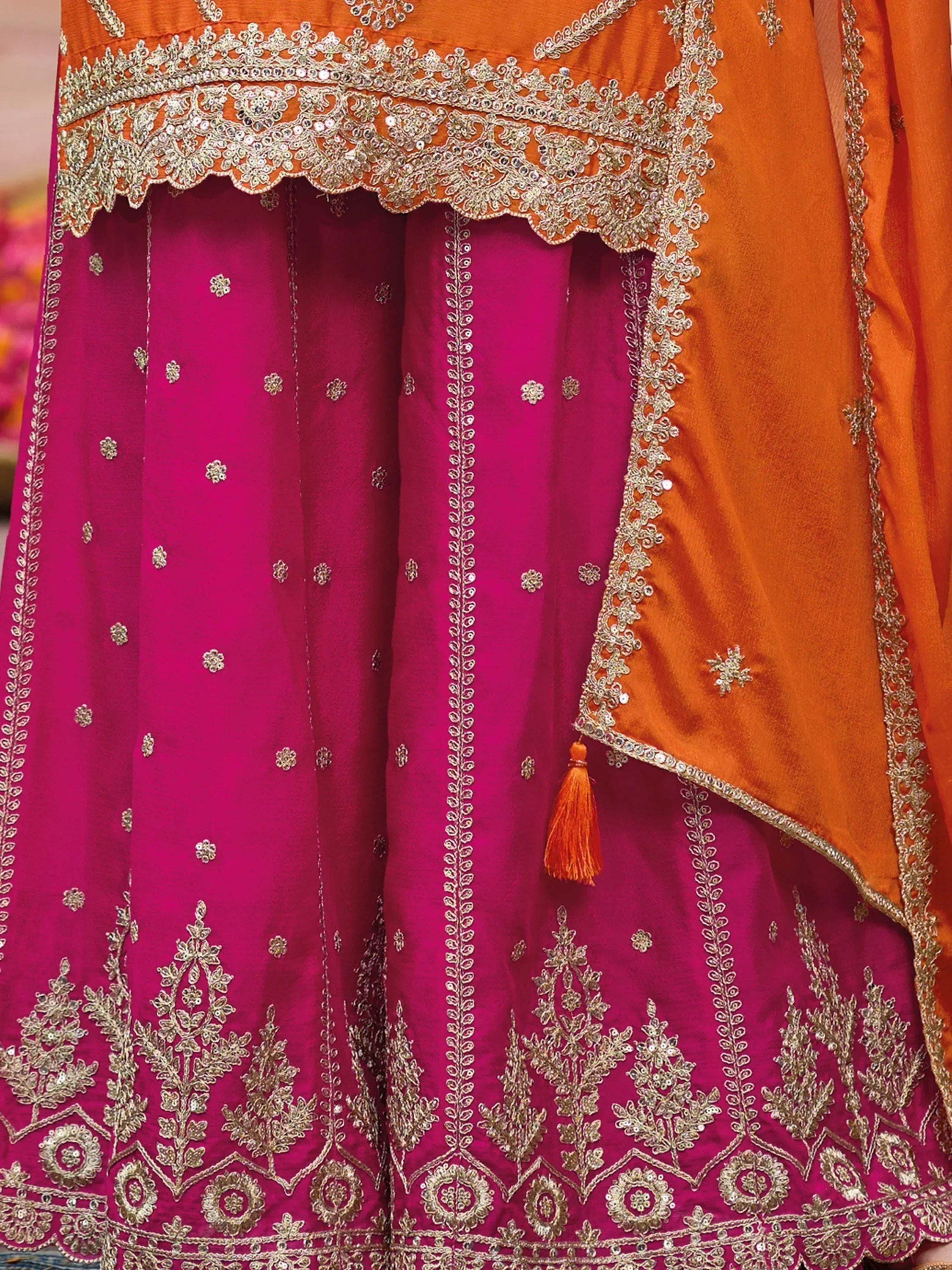 Fuchsia and orange designer lehenga choli with intricate gold embroidery and scalloped border