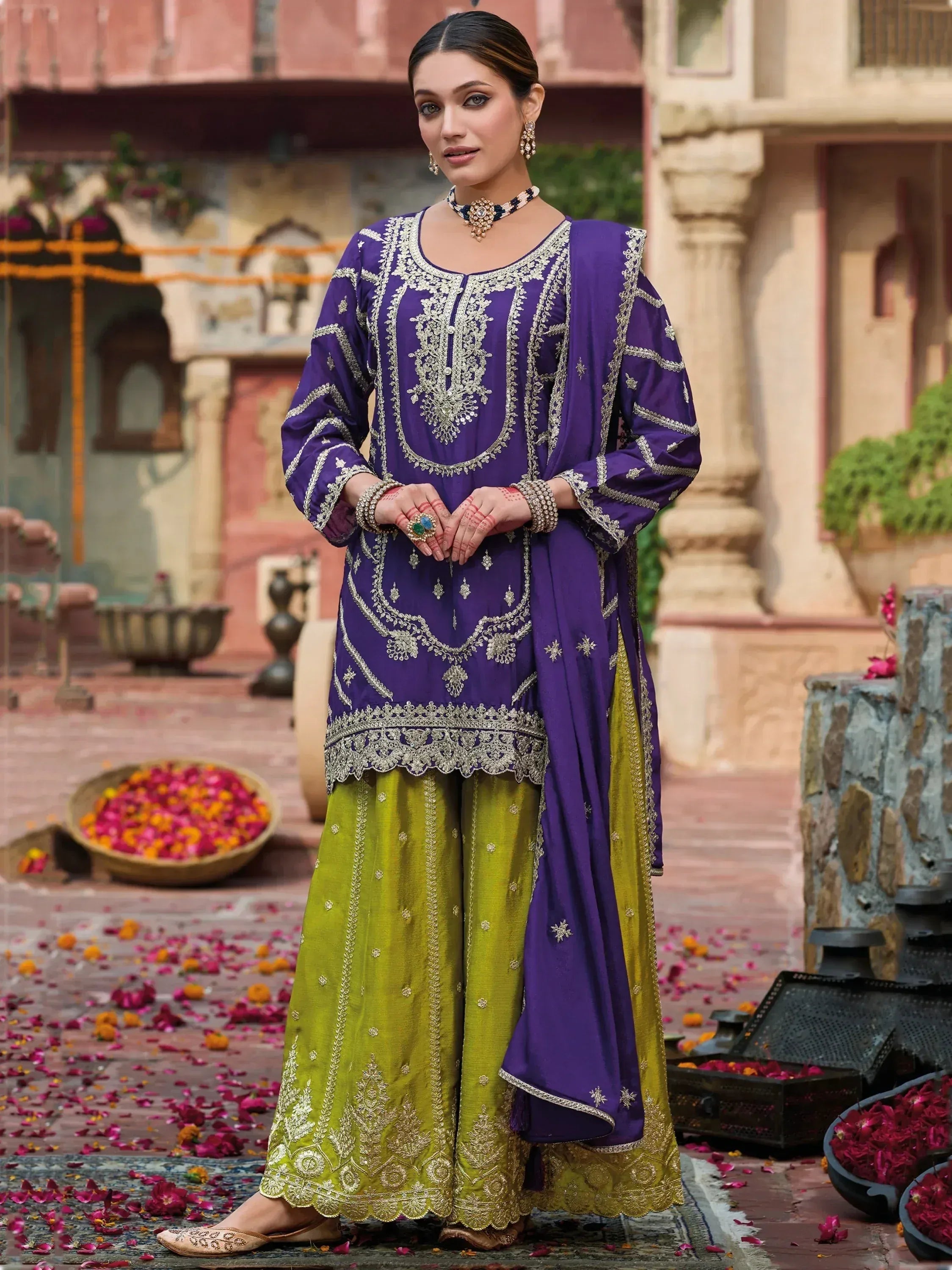 Purple and green embroidered salwar kameez with gold detailing, perfect for Indian ethnic occasions