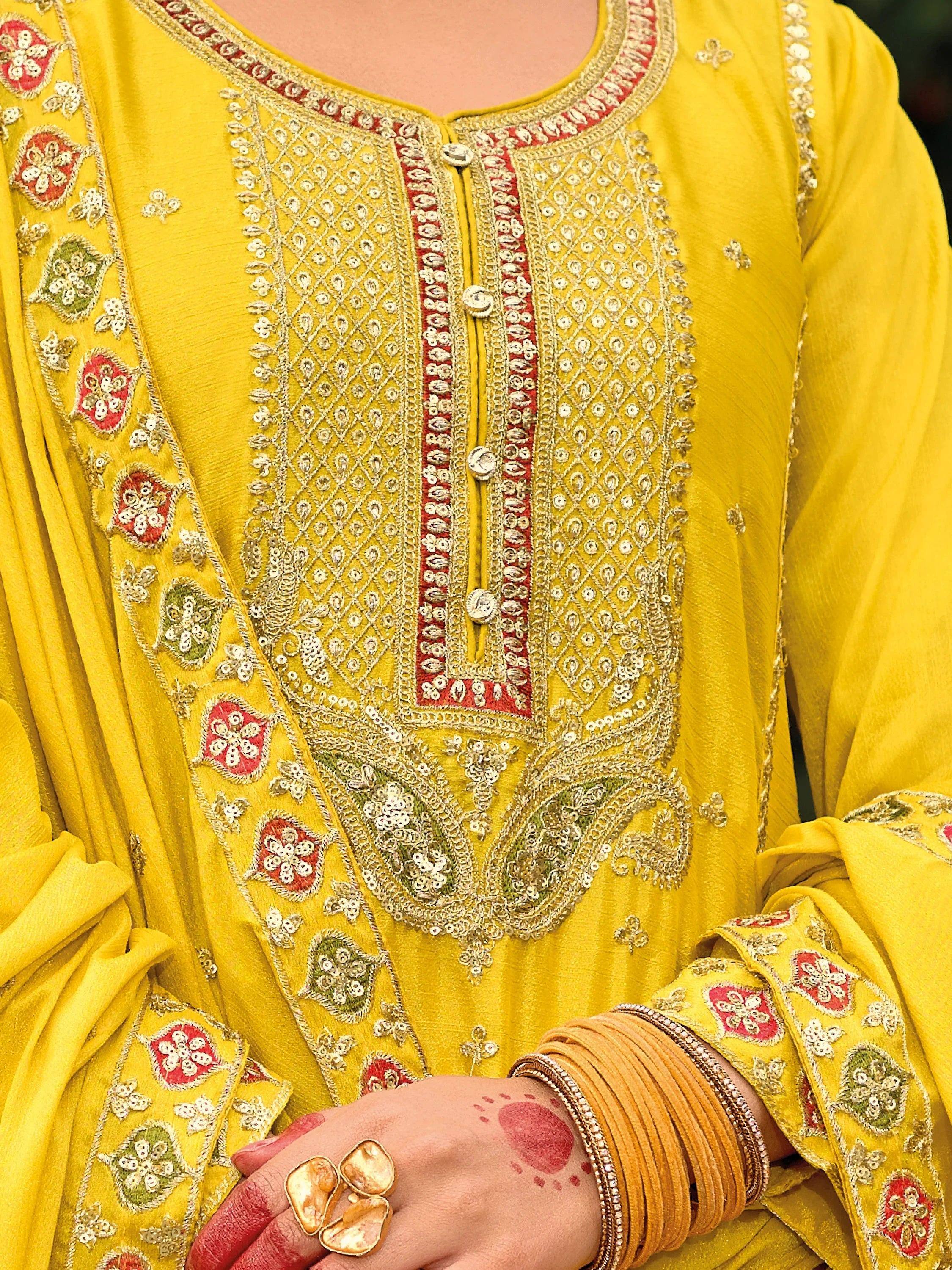 Yellow embroidered ethnic kurti with floral and geometric patterns, perfect for Indian wear