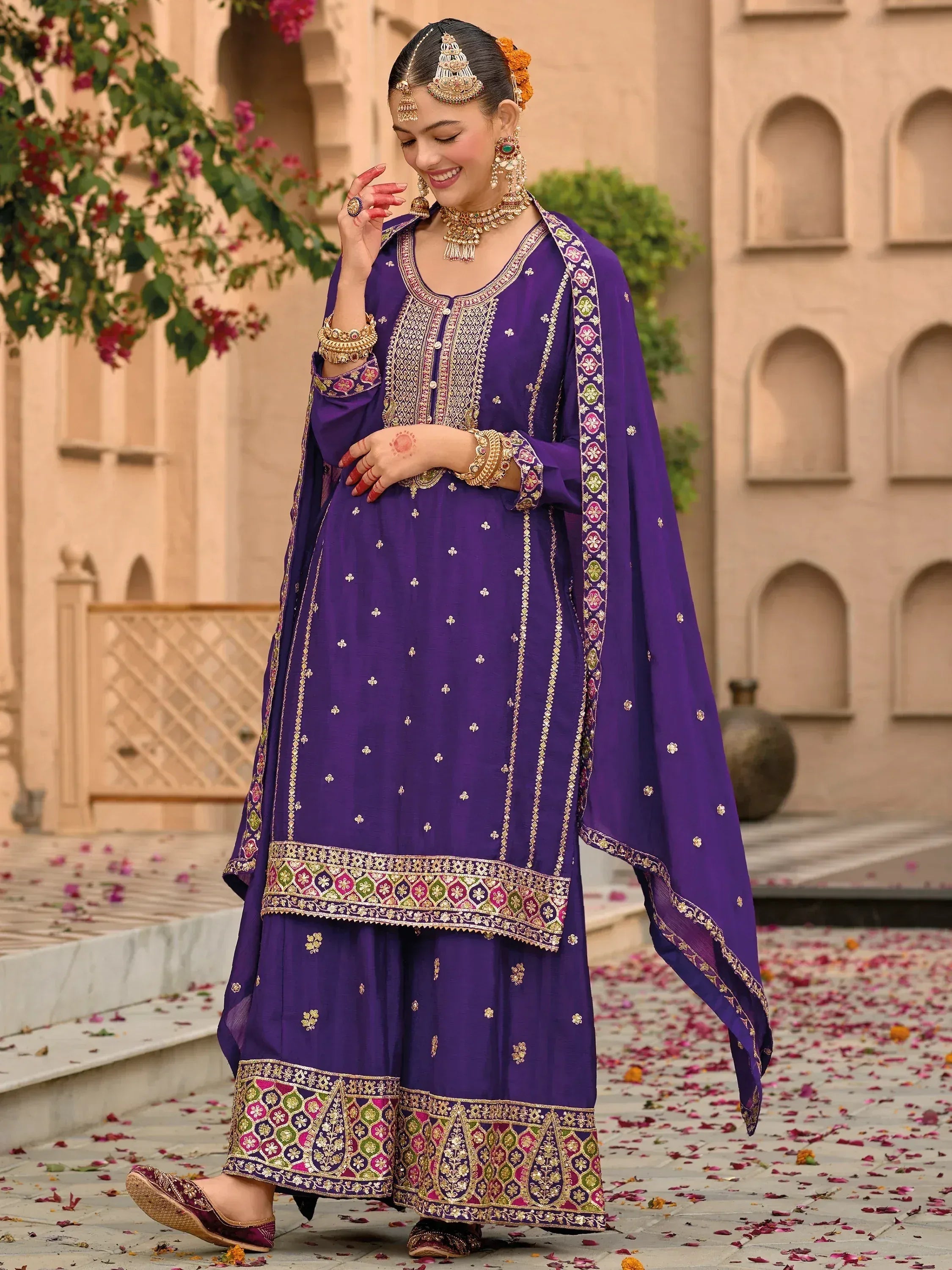 Purple embroidered salwar kameez with gold detailing, perfect for Indian ethnic wear occasions