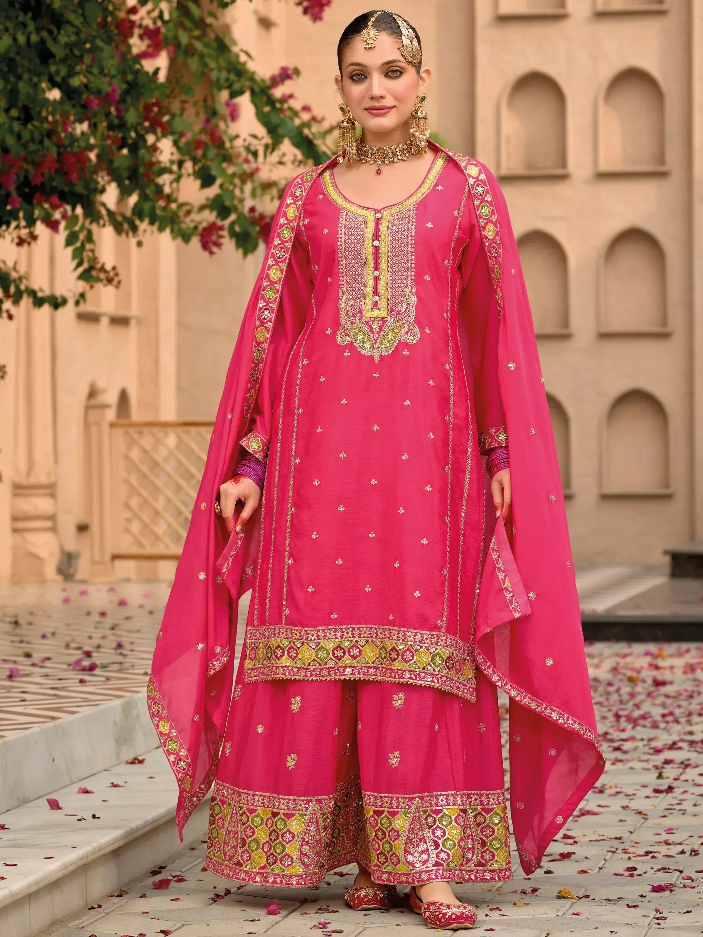 Pink embroidered salwar kameez with gold detailing, perfect for Indian ethnic wear occasions