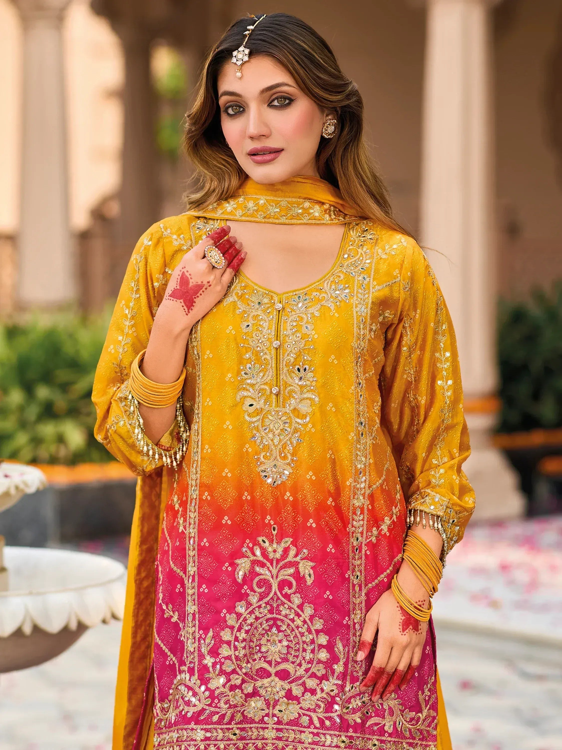 Yellow to pink ombre embroidered salwar kameez with mirror work and henna design