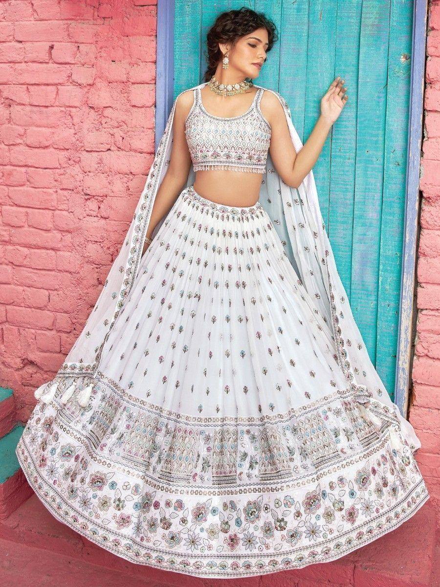 White embroidered lehenga choli with floral patterns, perfect for Indian ethnic wear occasions