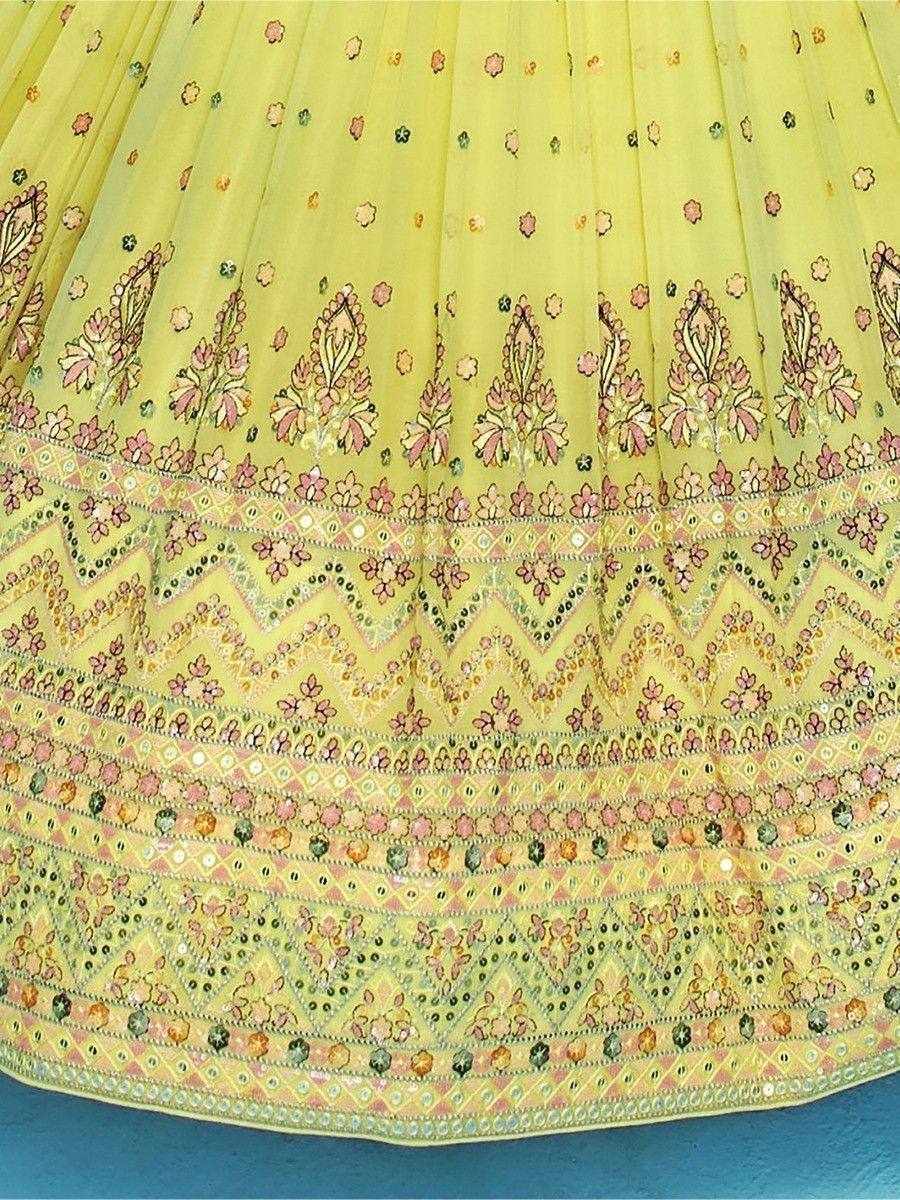 Yellow lehenga skirt with floral embroidery and mirror work, ethnic Indian wear