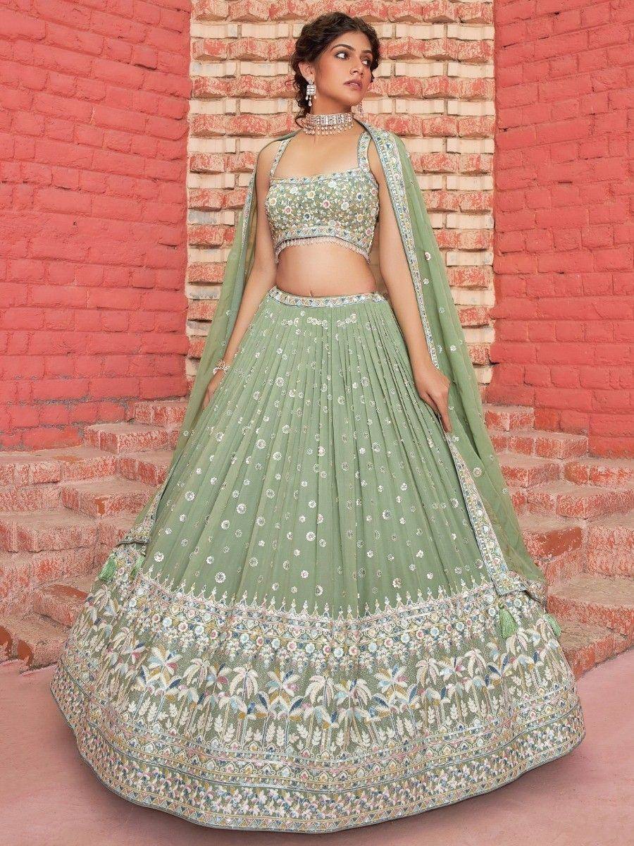 Mint green embroidered lehenga choli with floral motifs, perfect for Indian ethnic wear events