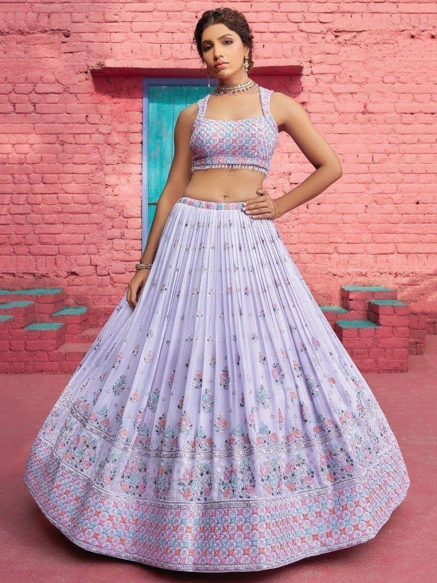Lavender floral lehenga choli with embroidered blouse and pleated skirt, perfect for Indian ethnic occasions.