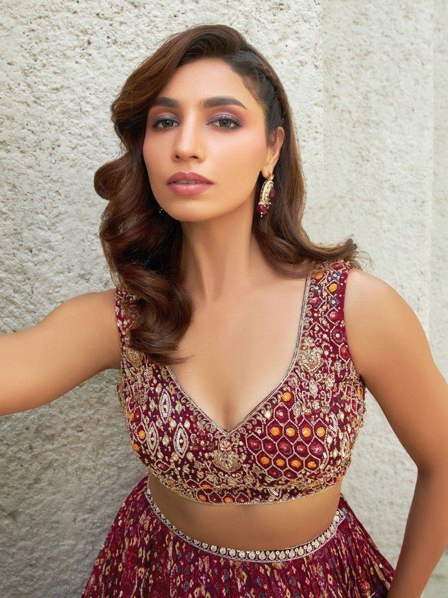 Maroon embroidered lehenga choli with gold detailing, perfect for Indian ethnic wear occasions