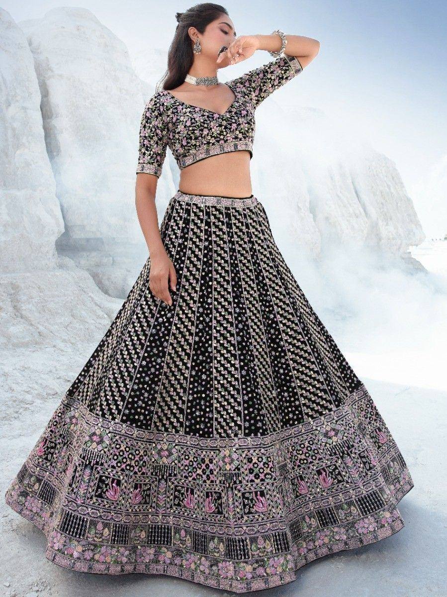 Black floral embroidered lehenga choli with pink detailing, perfect for Indian ethnic wear events
