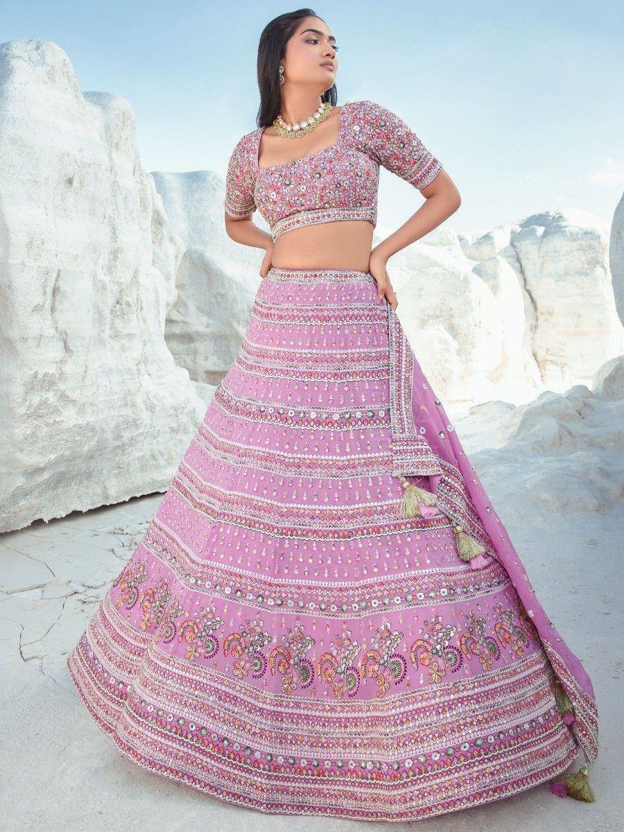 Pink embroidered lehenga choli with floral motifs, perfect for Indian ethnic wear and festive occasions