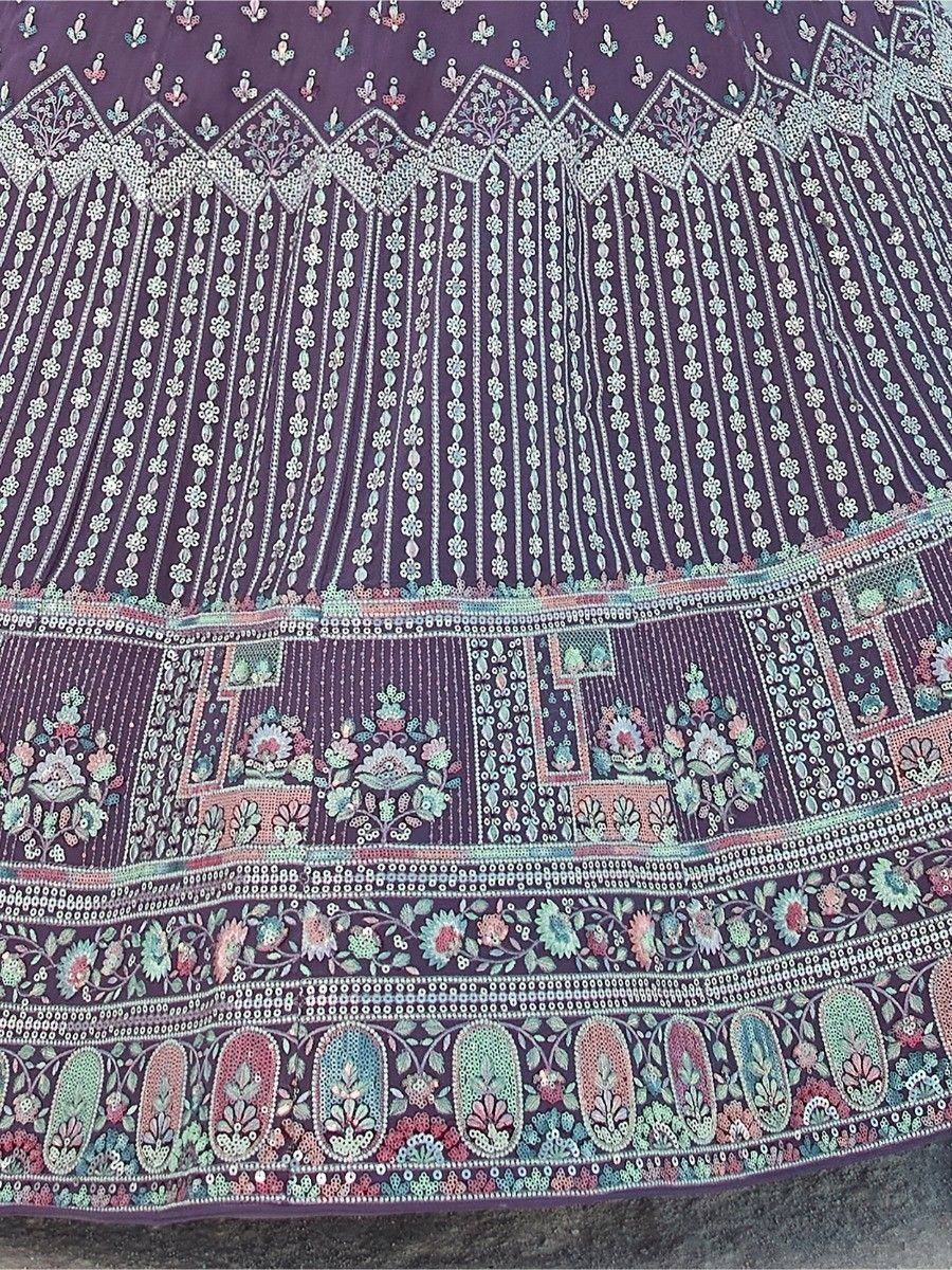 Purple ethnic lehenga with intricate floral embroidery and mirror work detailing