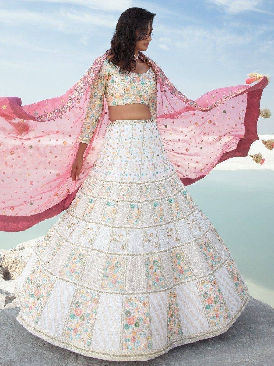 Floral embroidered white lehenga choli with pink dupatta, perfect for Indian ethnic occasions
