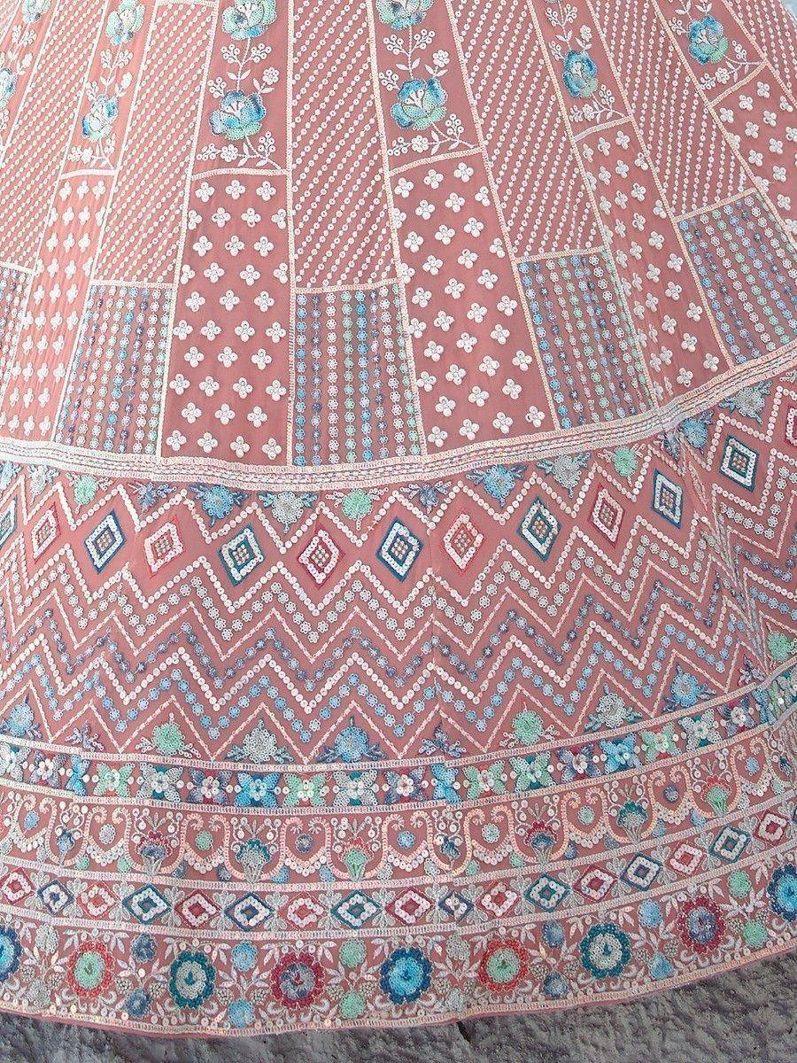 Pink embroidered lehenga skirt with floral and geometric patterns, perfect for Indian ethnic wear