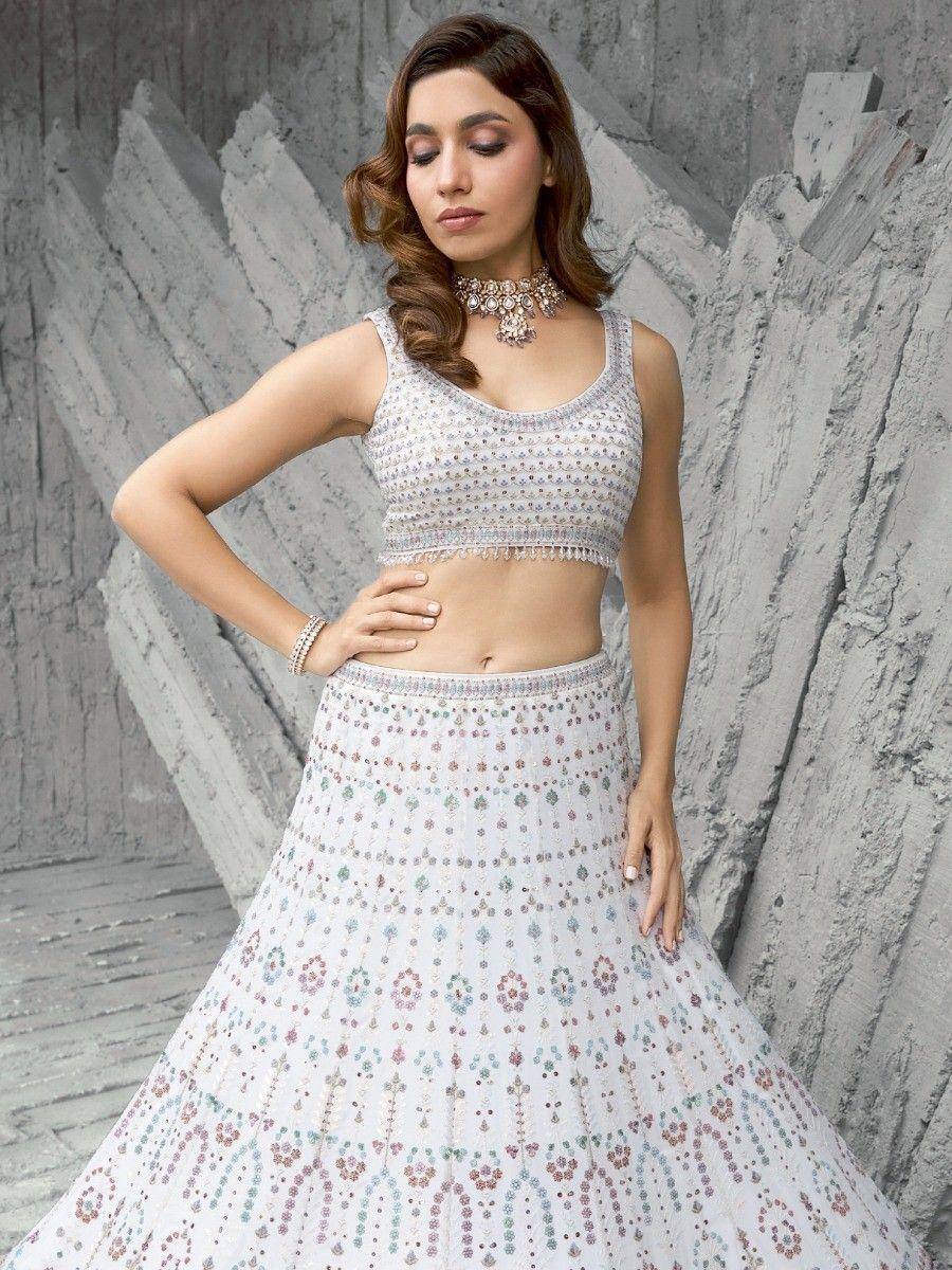 White embroidered lehenga choli with floral motifs, perfect for Indian ethnic wear events
