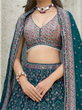 Pleasant Teal Blue Sequins Georgette Reception Wear Lehenga Choli