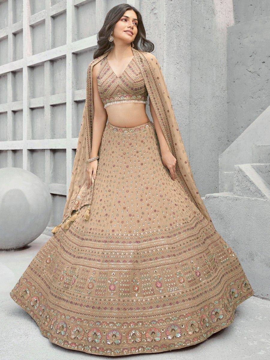Beige embroidered lehenga choli with floral motifs and dupatta, perfect for Indian ethnic occasions