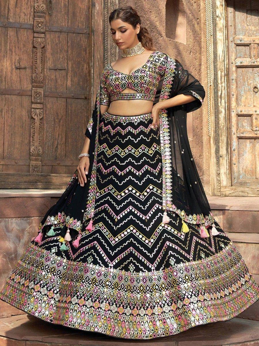 Black embroidered lehenga choli with mirror work and tassels, Indian ethnic wear for women