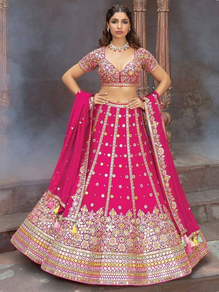 Pink designer lehenga choli with mirror work and floral embroidery, perfect for Indian weddings and festivals