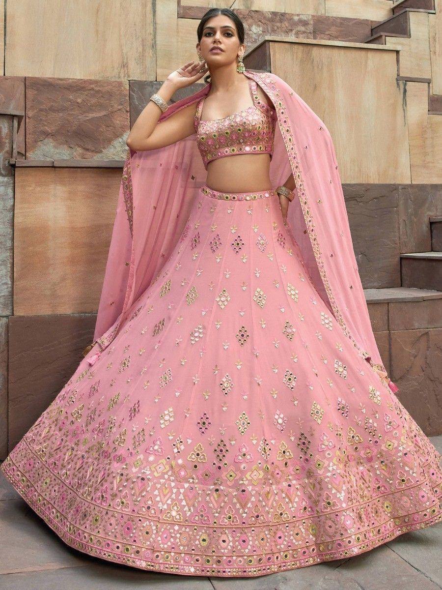 Pink designer lehenga choli with mirror work, perfect for Indian weddings and festive occasions