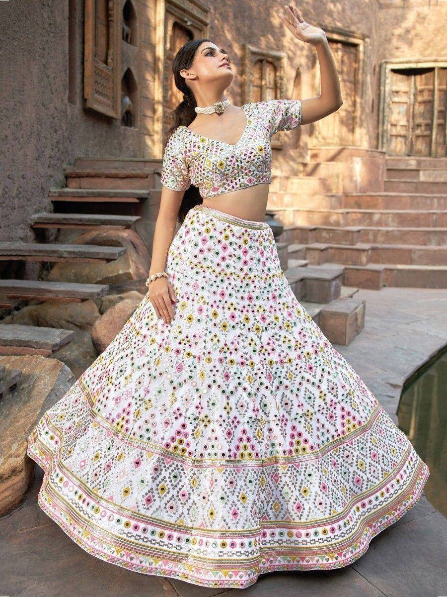 White floral mirror work lehenga choli with colorful embroidery, perfect for Indian ethnic occasions