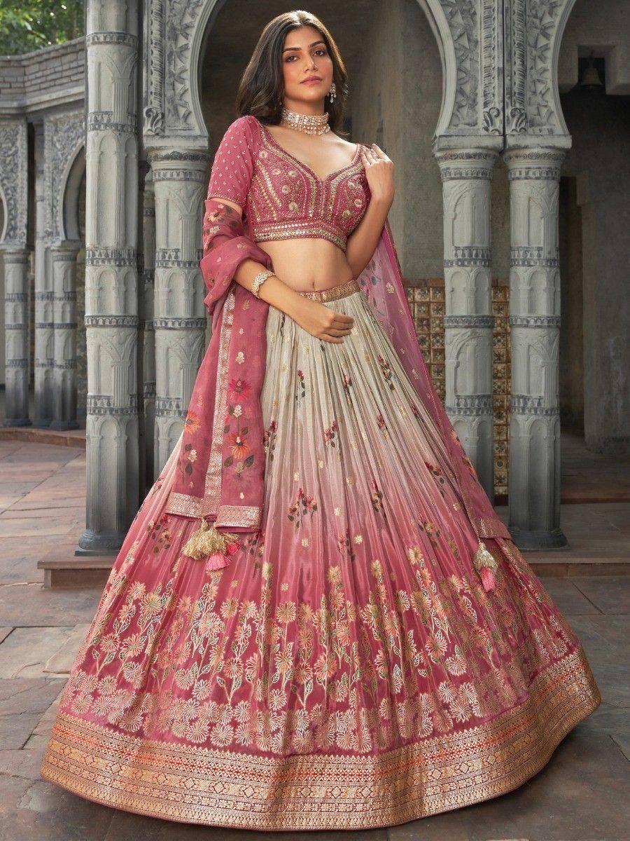 Pink floral embroidered lehenga choli with gold detailing, perfect for Indian weddings and festive occasions.