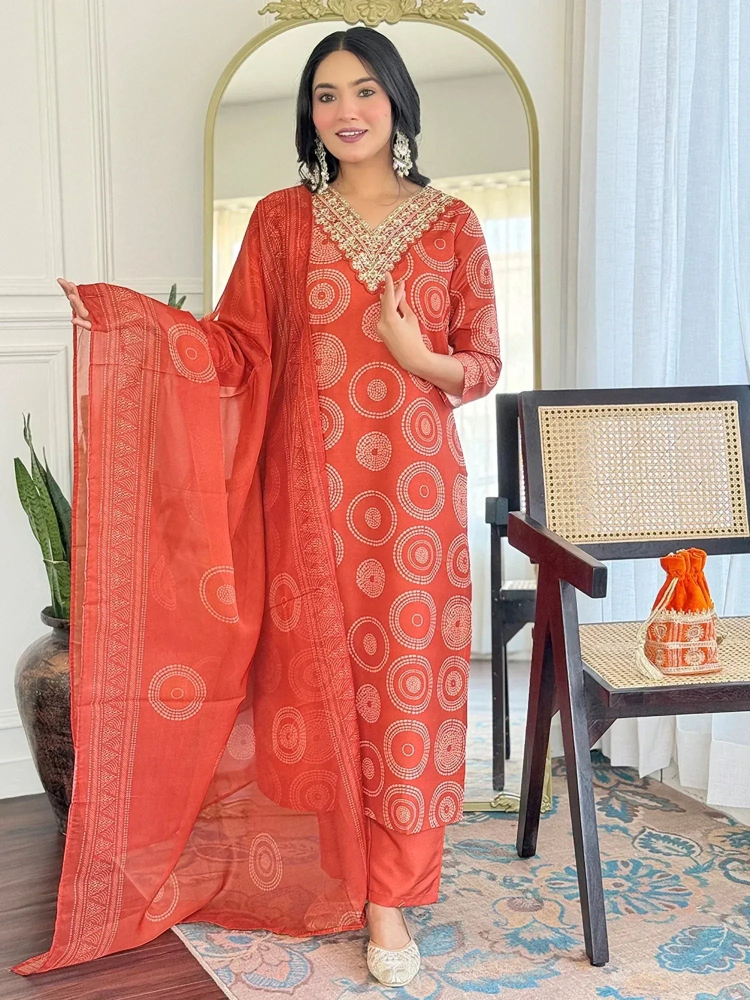 Orange printed salwar kameez with embroidered neckline and matching dupatta, ethnic wear for women