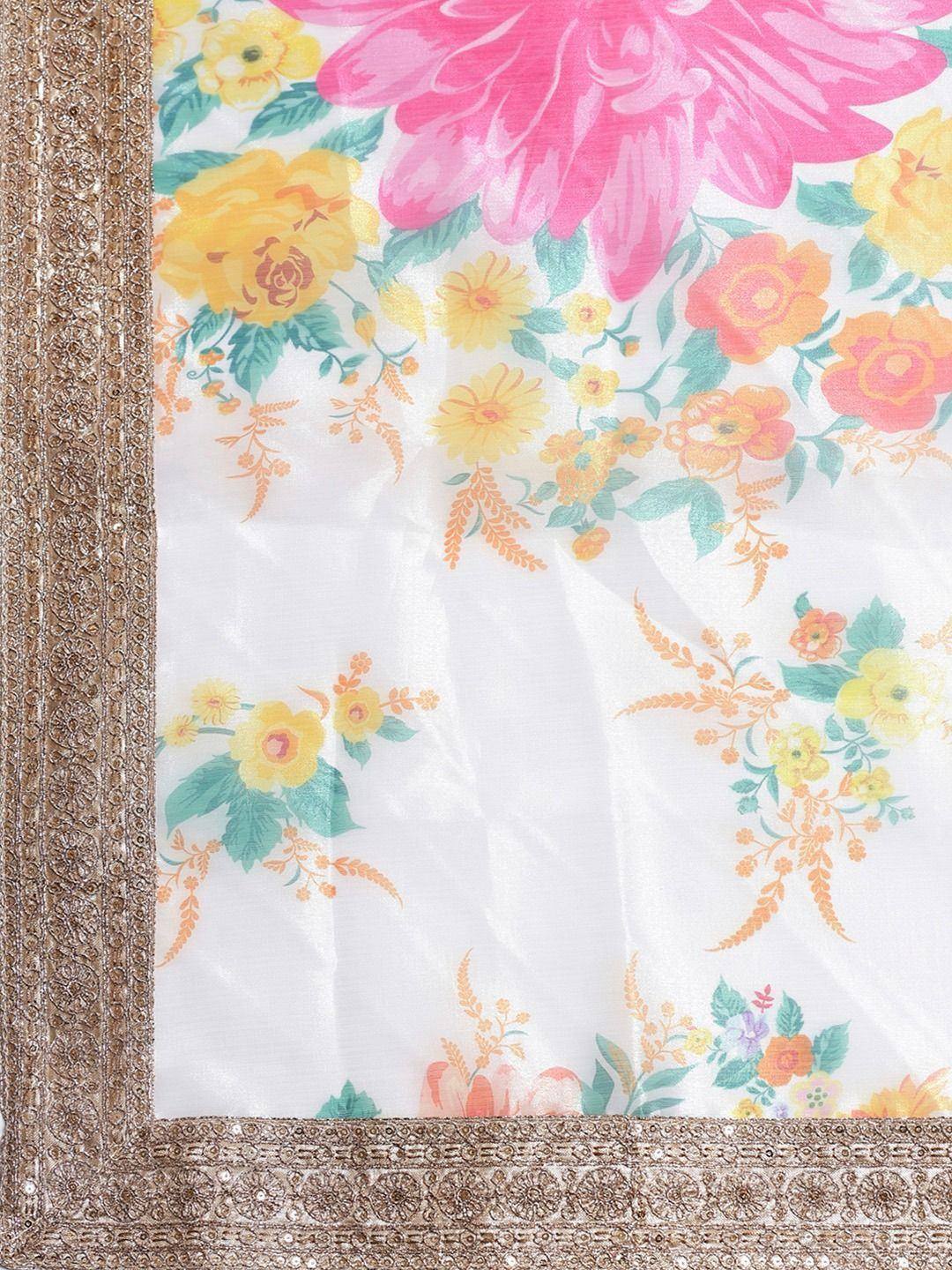 Floral printed ethnic saree with golden embroidered border, vibrant pink and yellow flowers on white fabric