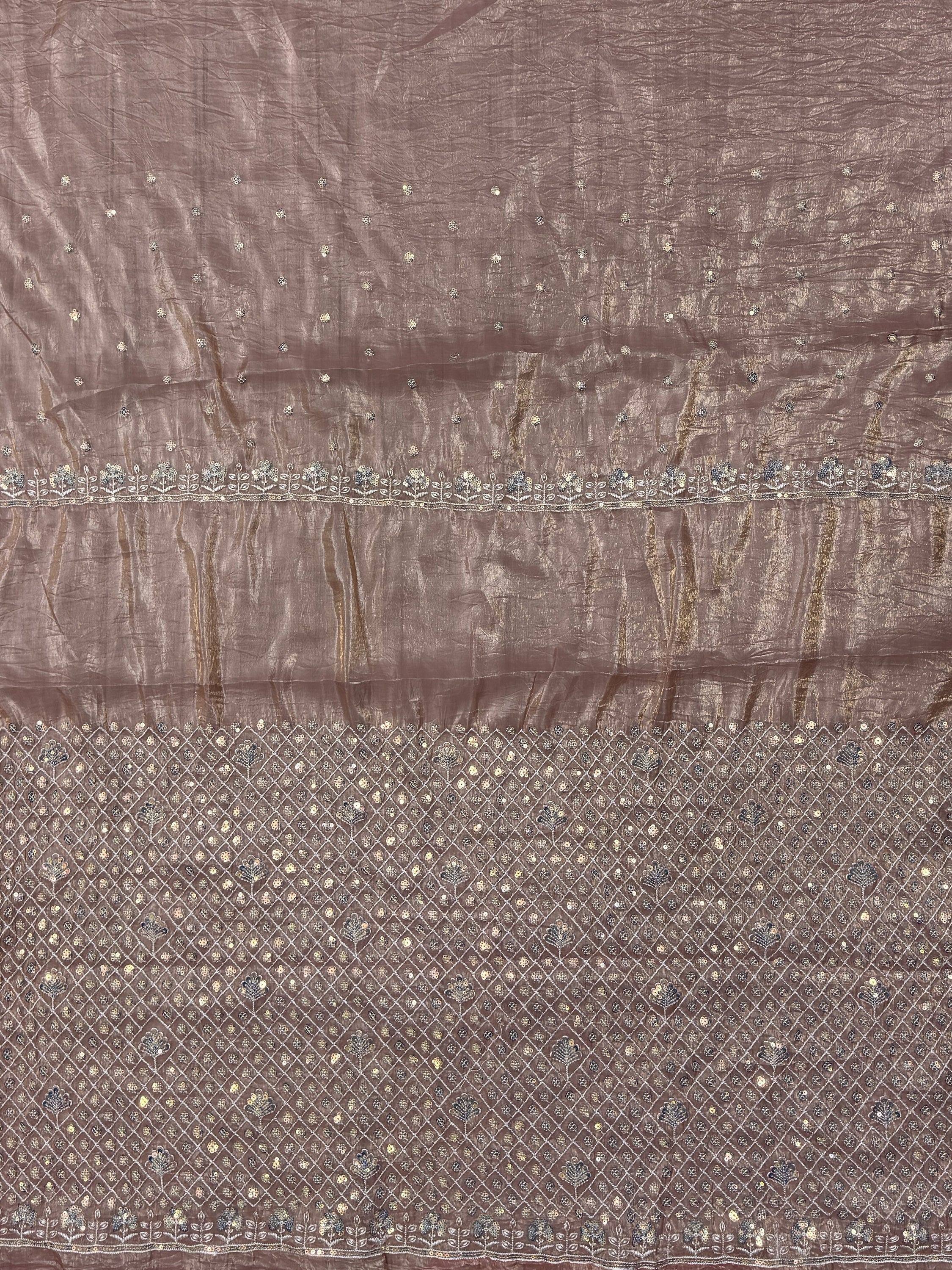 Brown ethnic saree with floral embroidery and sequin detailing, perfect for Indian festive wear