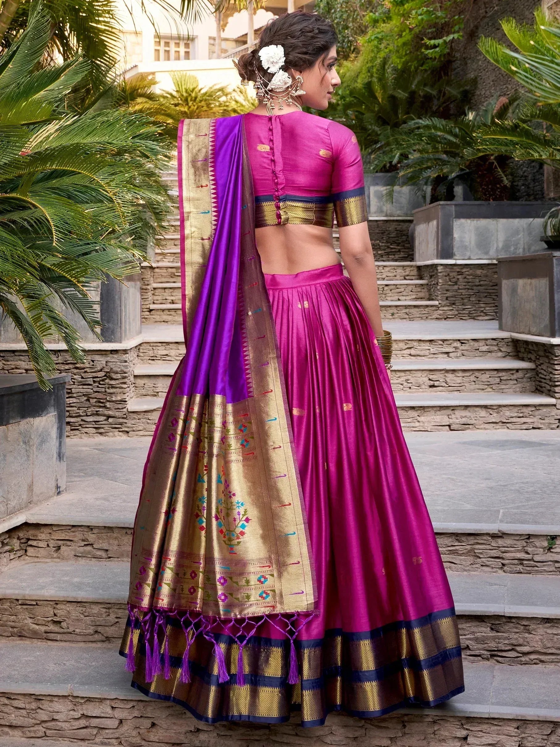 Pink and purple designer lehenga choli with gold embroidery, perfect for Indian ethnic wear occasions.