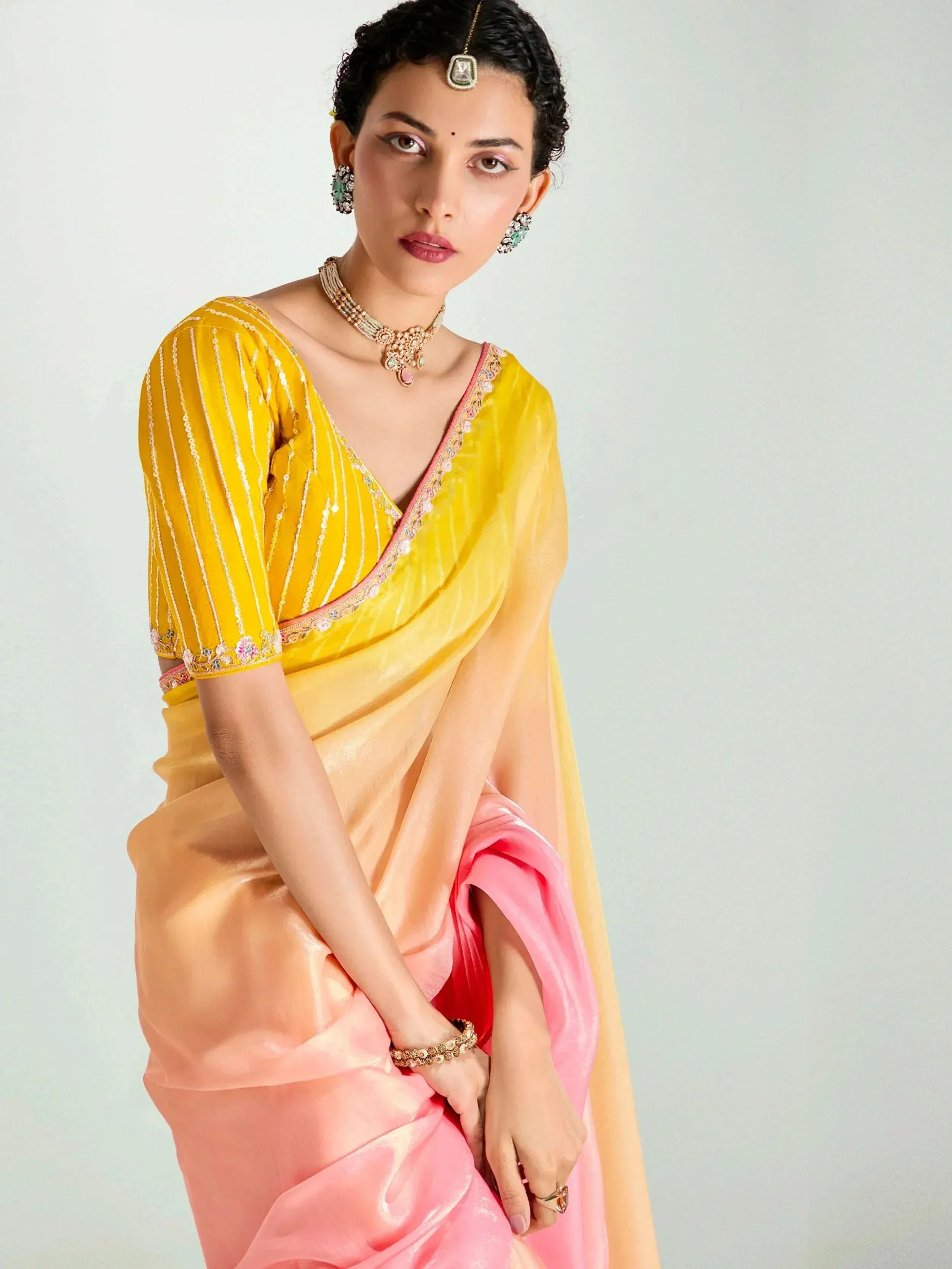Yellow and pink designer saree with embroidered blouse, perfect for ethnic occasions and festive wear.