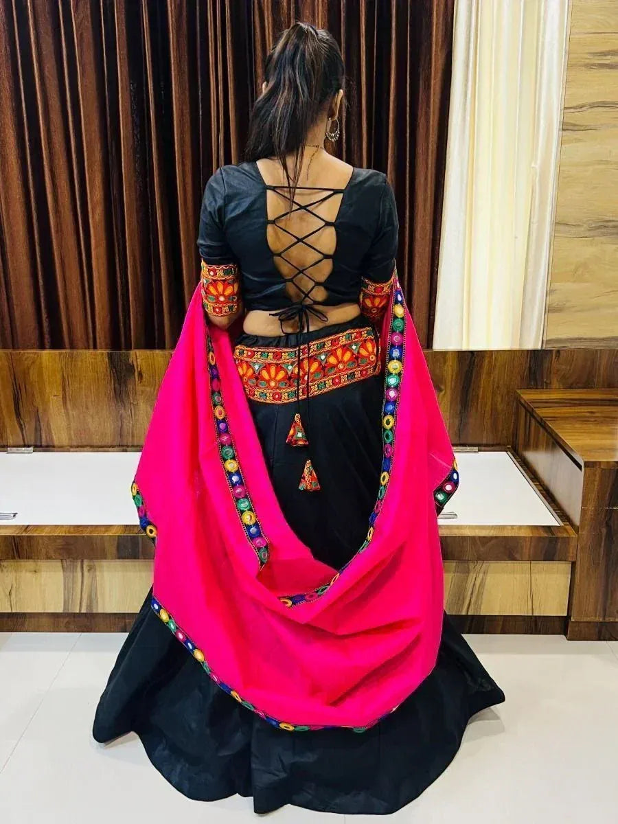 Black and pink ethnic lehenga choli with back crisscross design and colorful embroidery