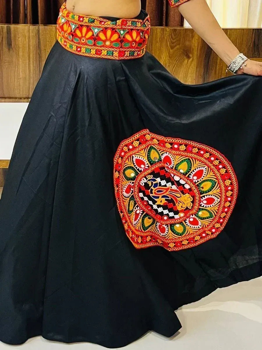 Black ethnic skirt with vibrant floral and peacock embroidery, perfect for Indian festive wear
