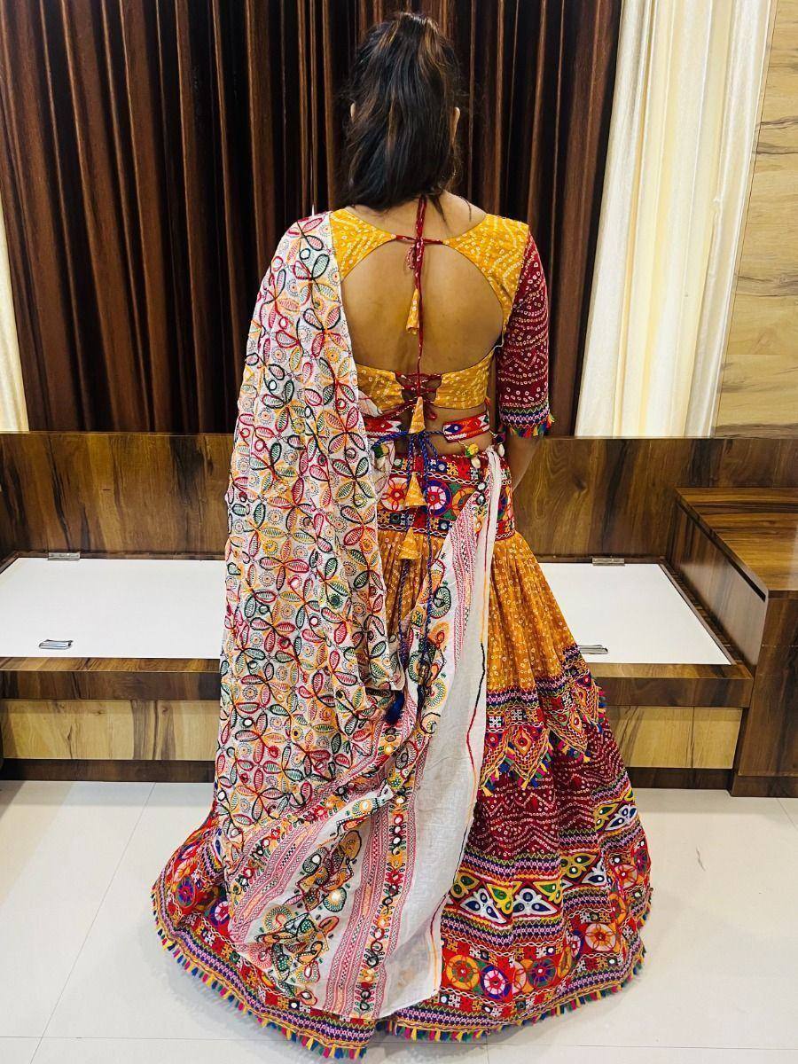 Back view of colorful embroidered lehenga choli with open back blouse and dupatta, ethnic Indian wear