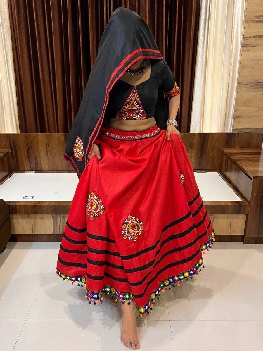 Red and black embroidered ethnic lehenga choli with mirror work and dupatta, traditional Indian wear