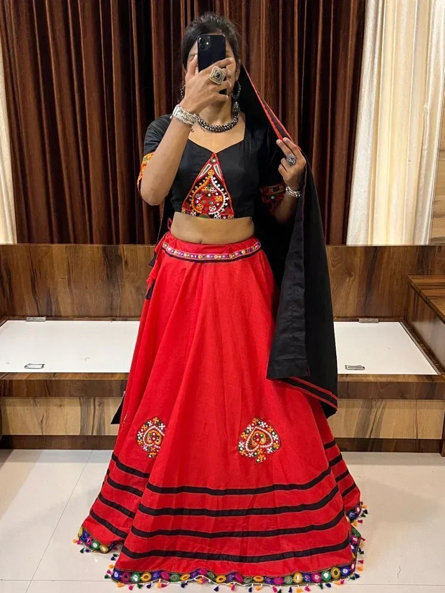 Red and black embroidered lehenga choli with mirror work, perfect for Indian ethnic wear occasions