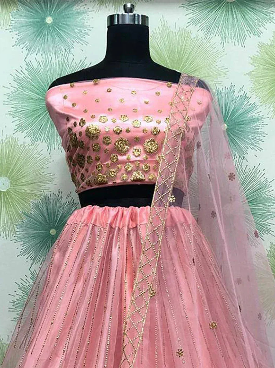 Pink off-shoulder lehenga choli with gold floral embroidery and sheer dupatta, perfect for Indian ethnic wear