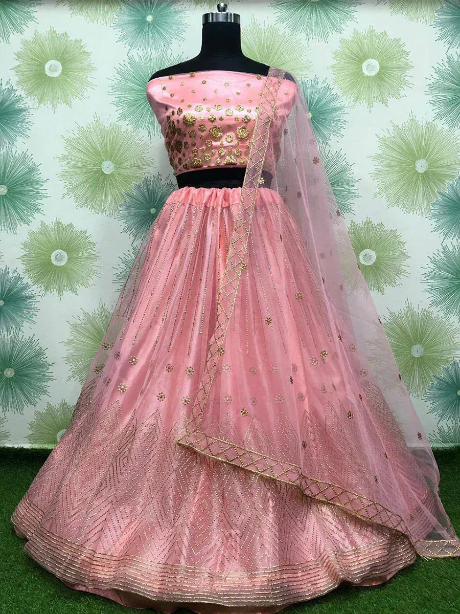 Pink designer lehenga choli with gold embroidery and net dupatta, perfect for Indian ethnic occasions