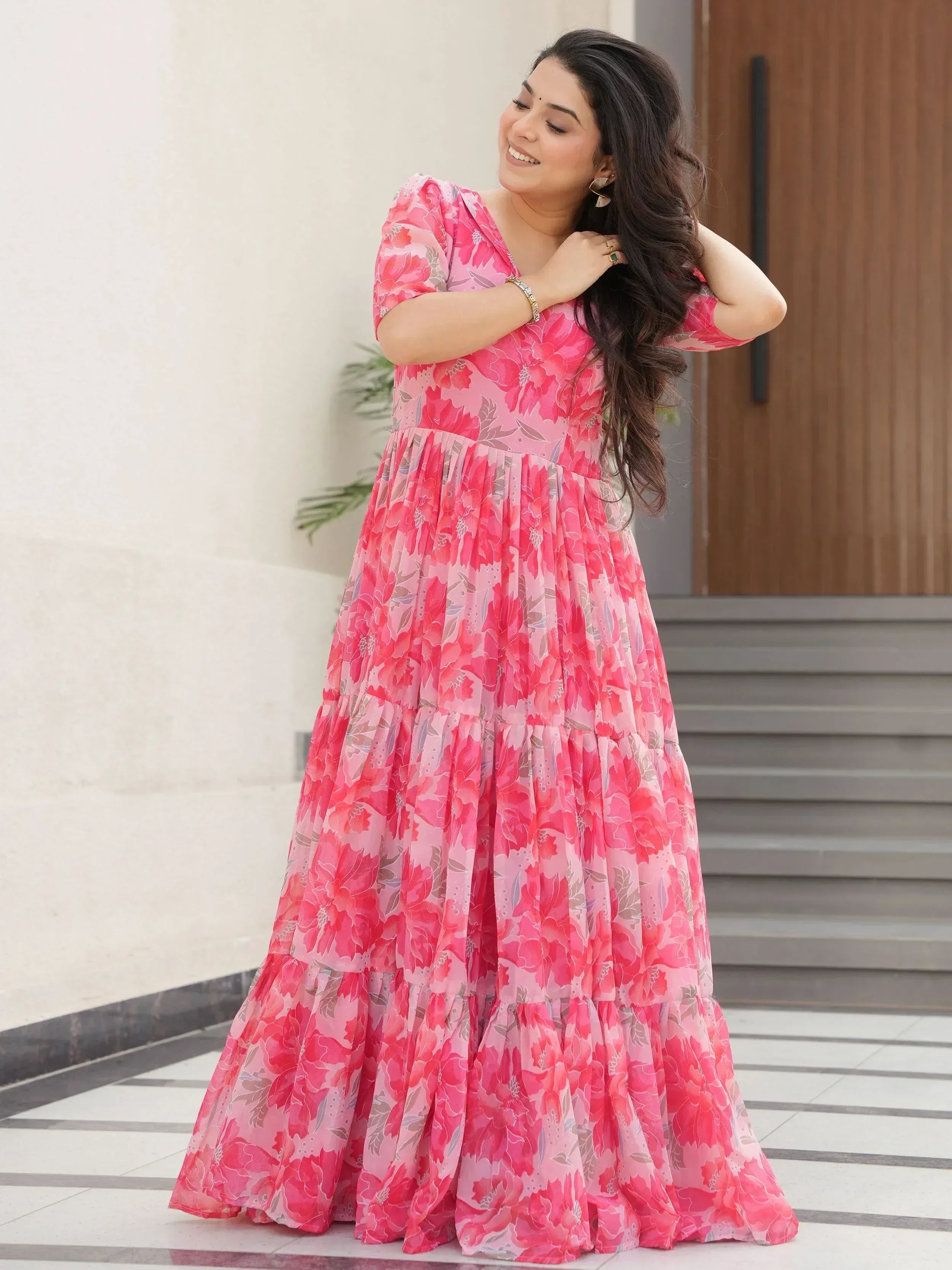 Pink floral ethnic gown with tiered skirt, perfect for Indian occasions and festive wear.