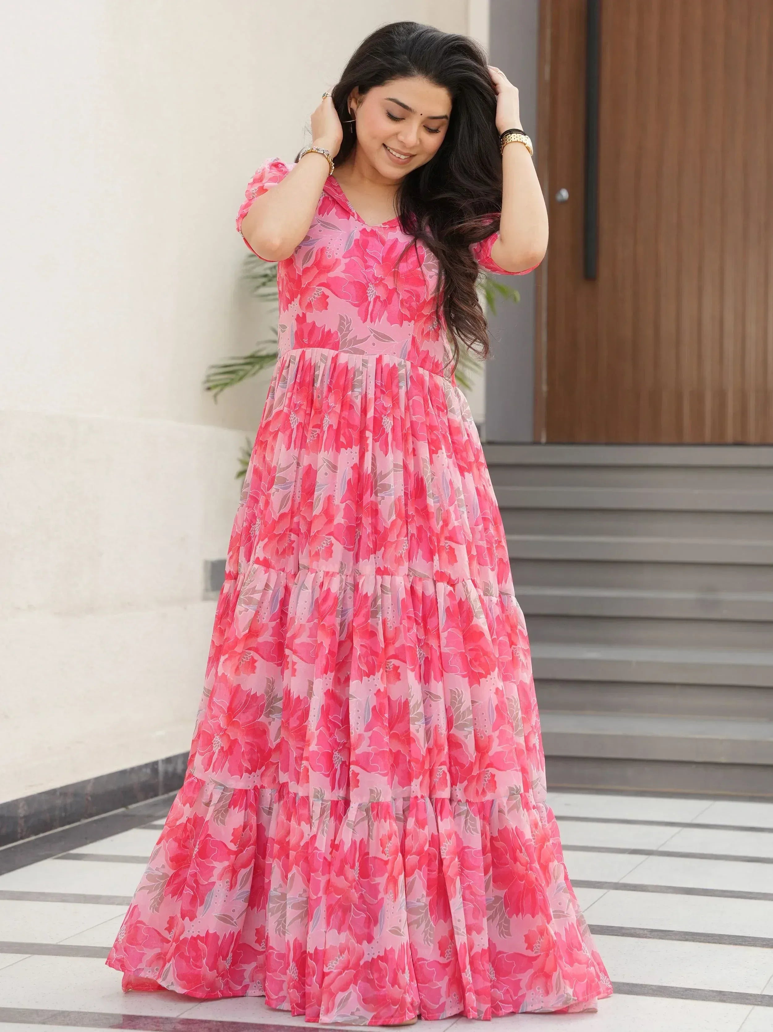 Pink floral ethnic gown with tiered skirt, perfect for Indian occasions and festive wear.