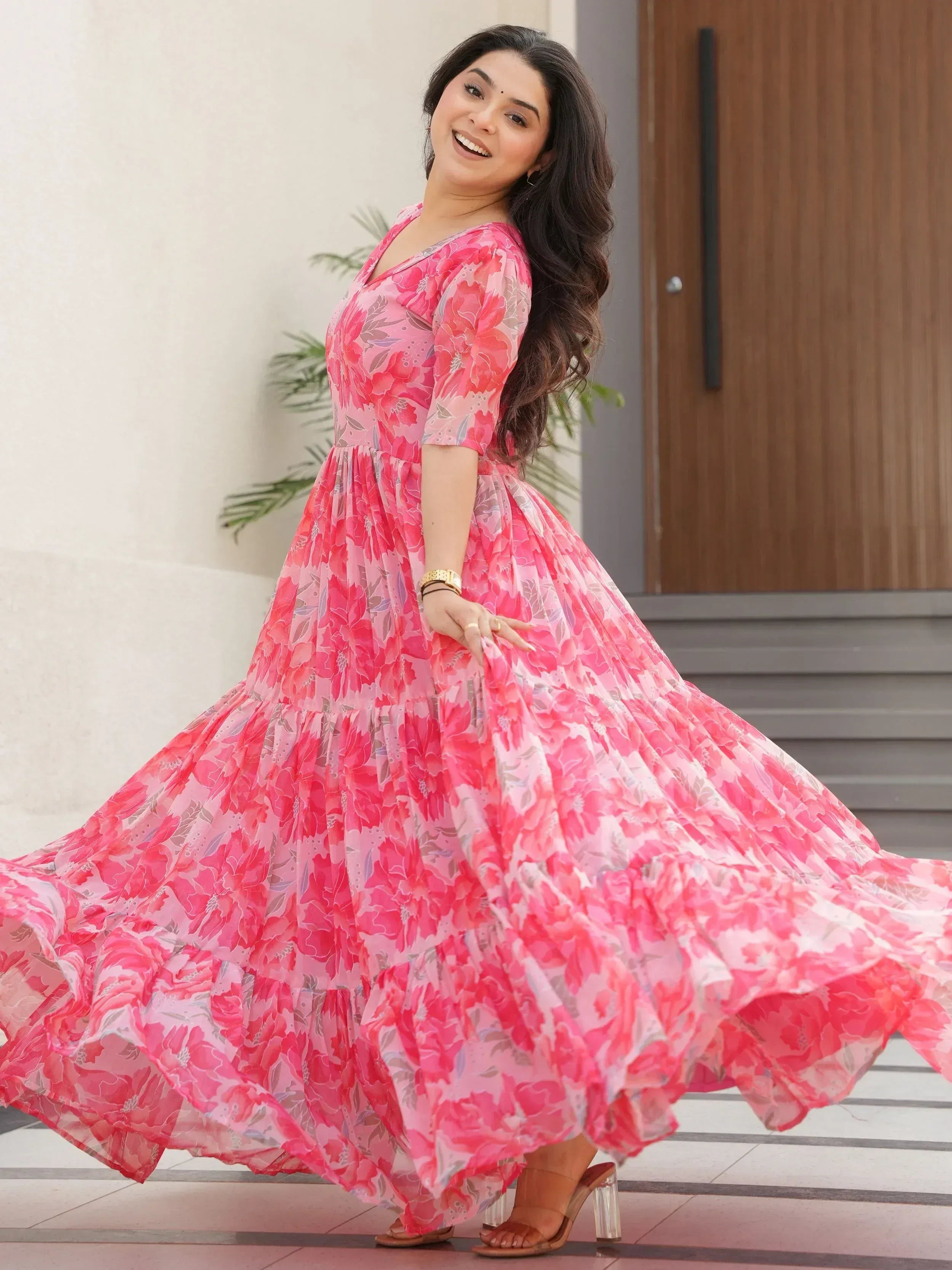Pink floral print ethnic gown with flared skirt, perfect for festive occasions and parties.
