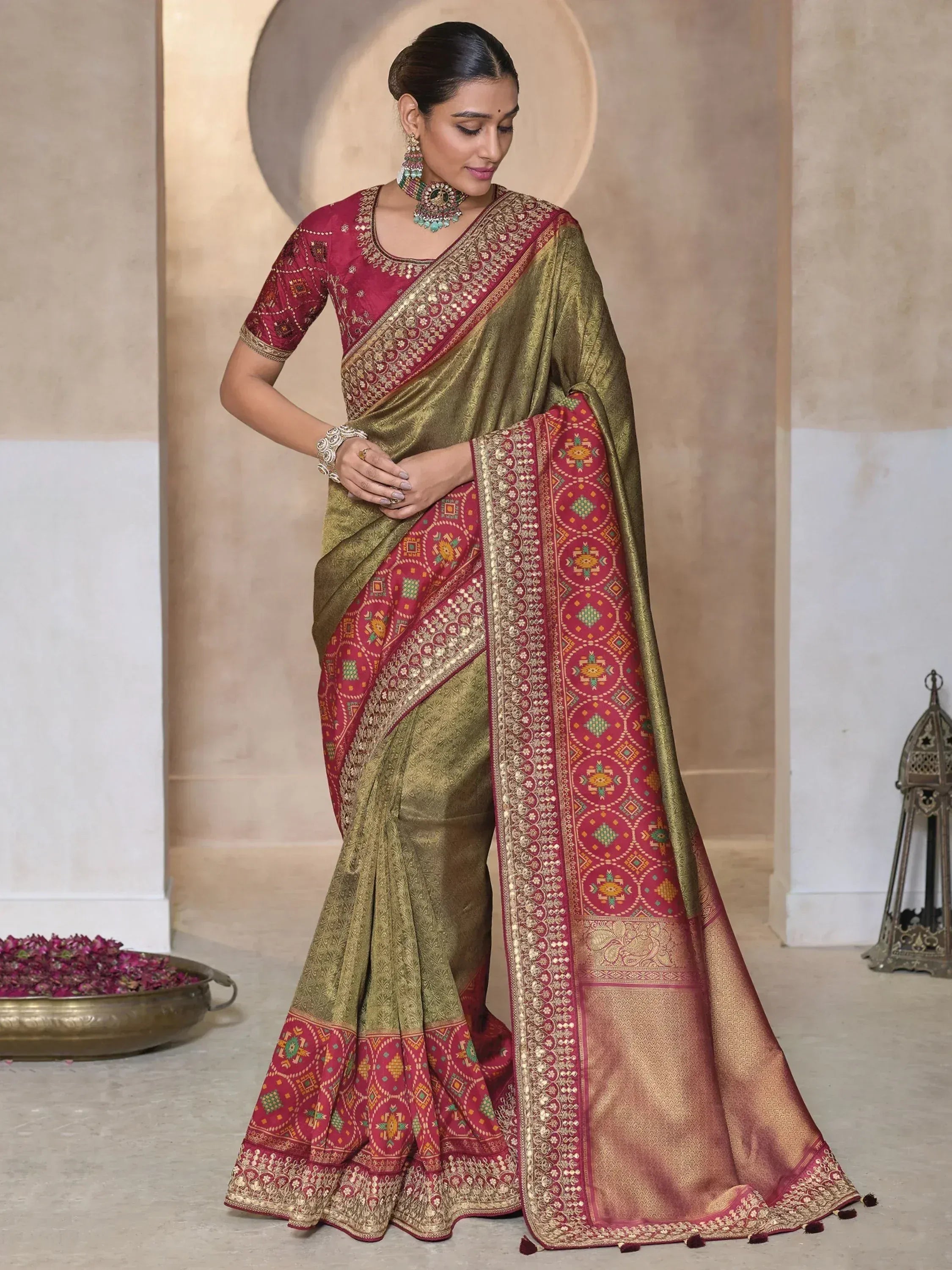 Elegant olive green and maroon saree with intricate gold embroidery and geometric border, perfect for Indian ethnic occasions.