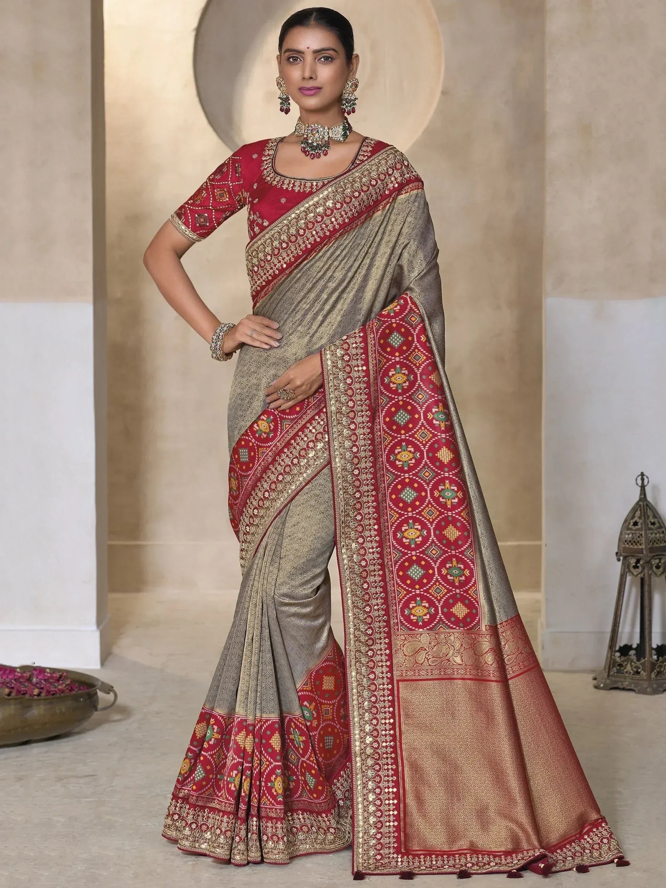 Elegant Indian saree with red and gold embroidery, perfect for festive occasions and weddings