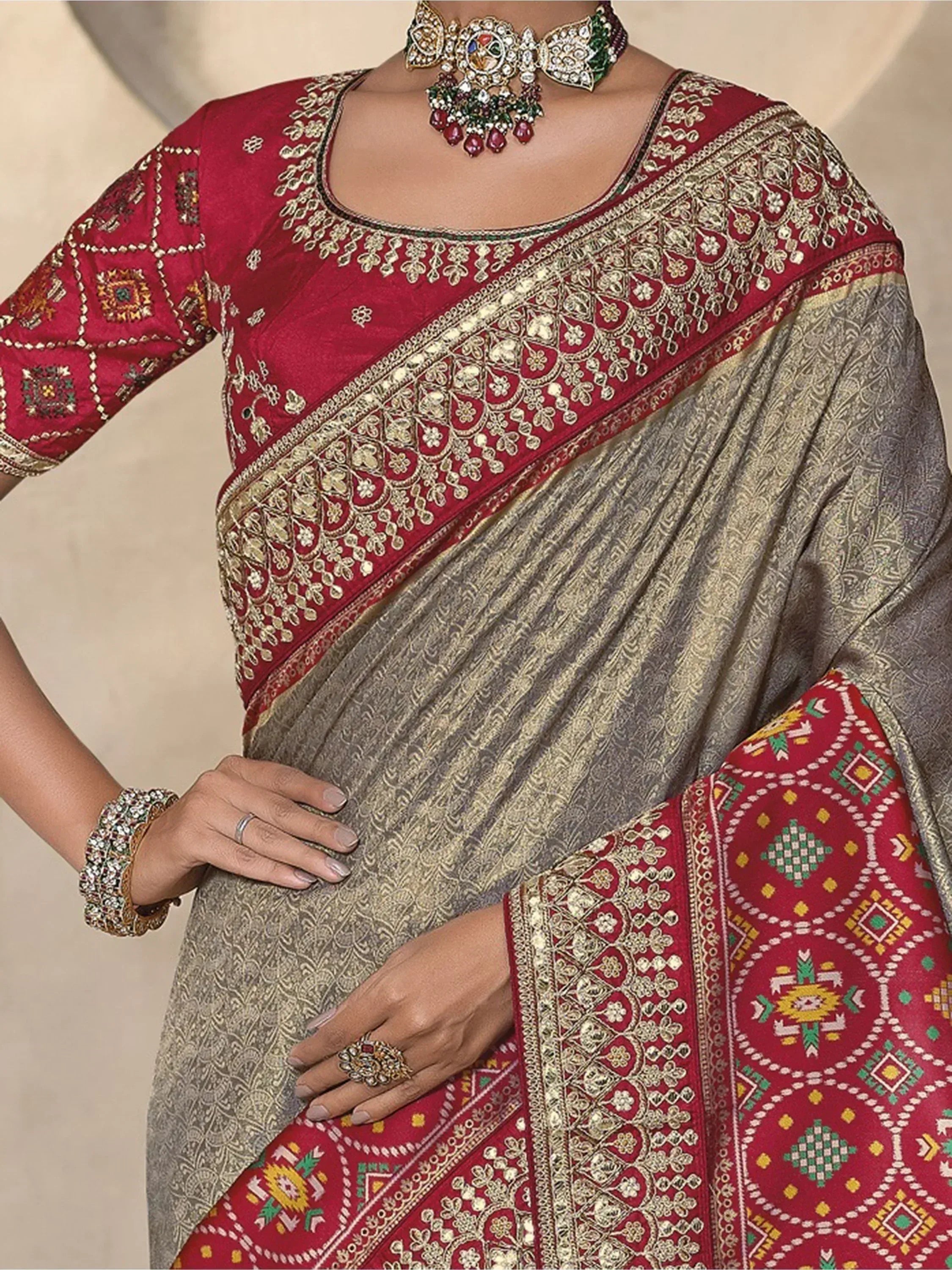 Elegant Indian saree with red blouse, gold embroidery, and traditional jewelry for ethnic wear