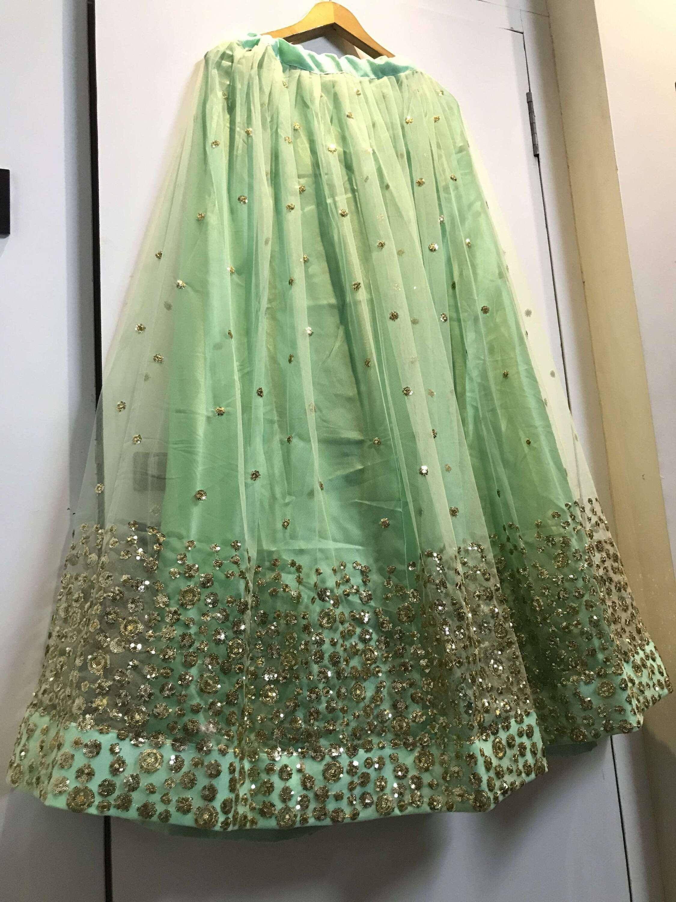 Mint green lehenga skirt with gold floral embroidery and sequin detailing, perfect for Indian ethnic wear
