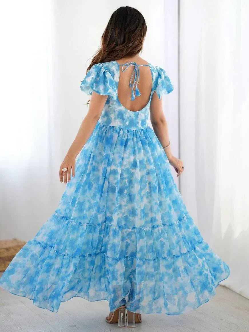 Blue tie-dye ethnic gown with ruffled sleeves and open back, perfect for Indian festive occasions