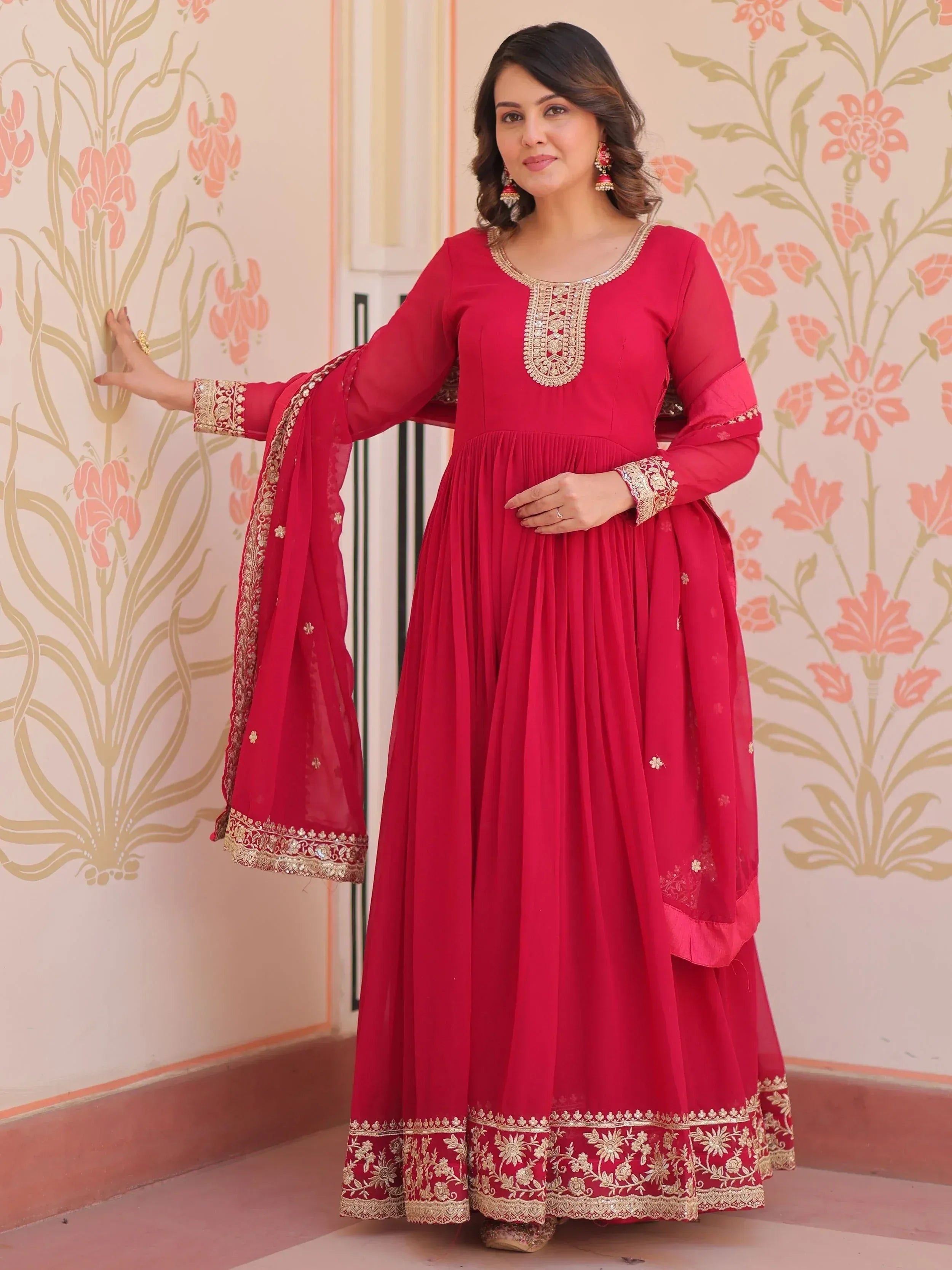Red ethnic anarkali gown with gold embroidery, perfect for Indian weddings and festive occasions