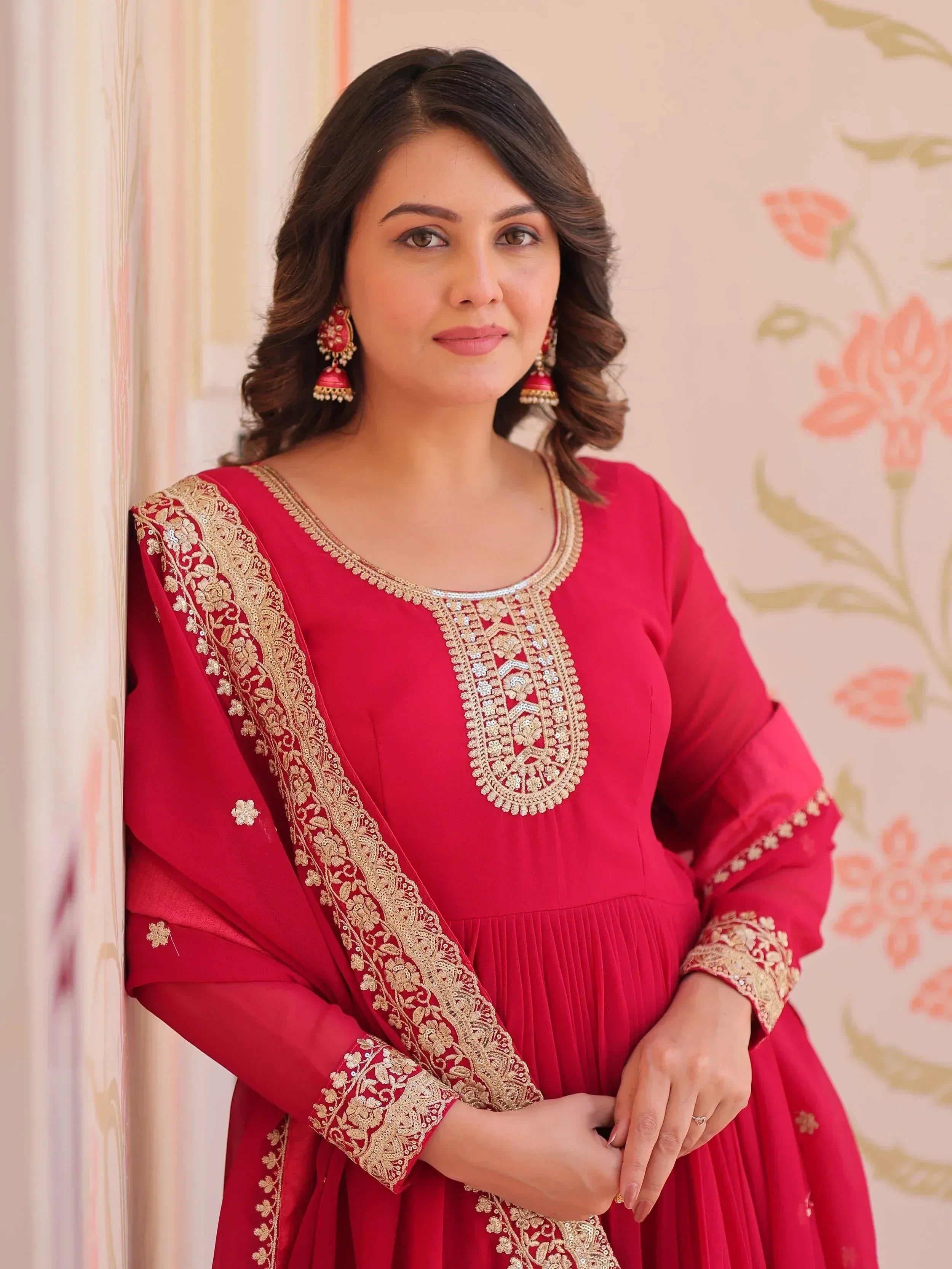 Red ethnic gown with gold embroidery, perfect for Indian occasions and festive wear.