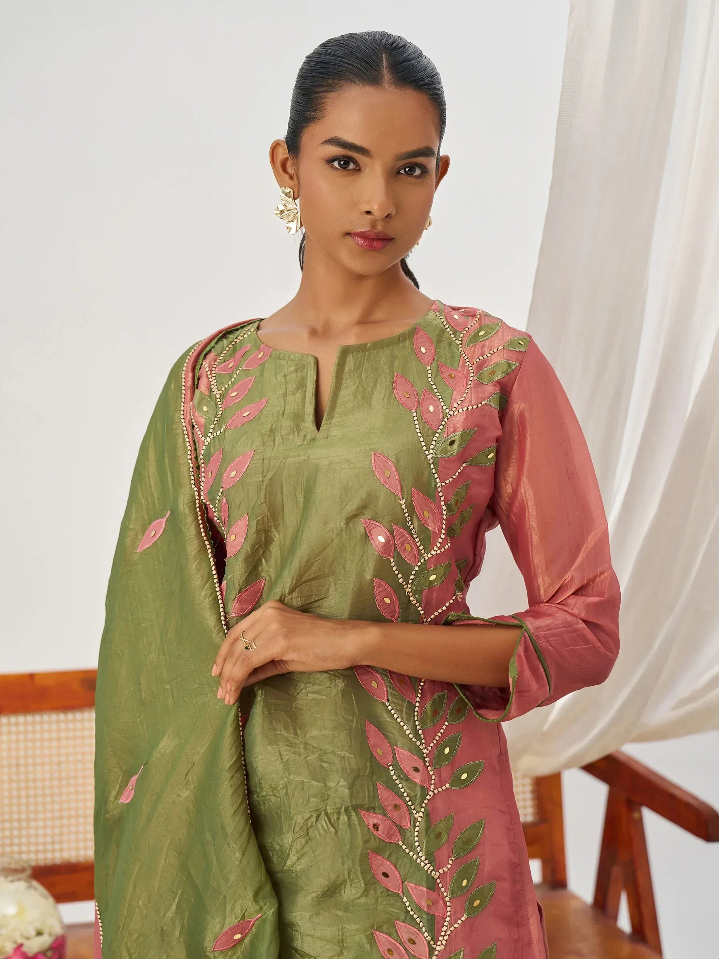 Green and pink embroidered ethnic kurta with leaf motif, perfect for Indian festive wear