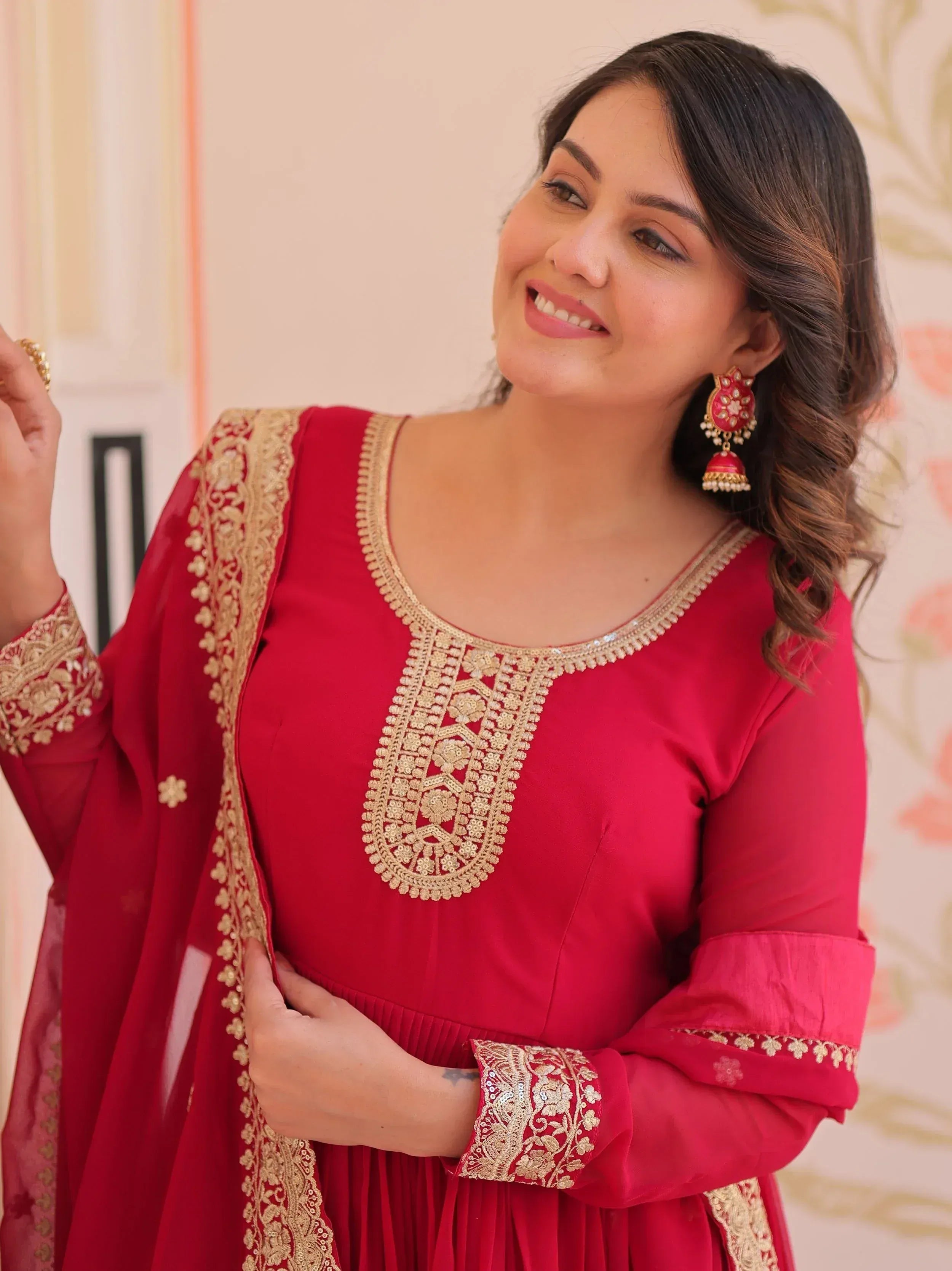 Red ethnic gown with gold embroidery, perfect for Indian festive wear and special occasions