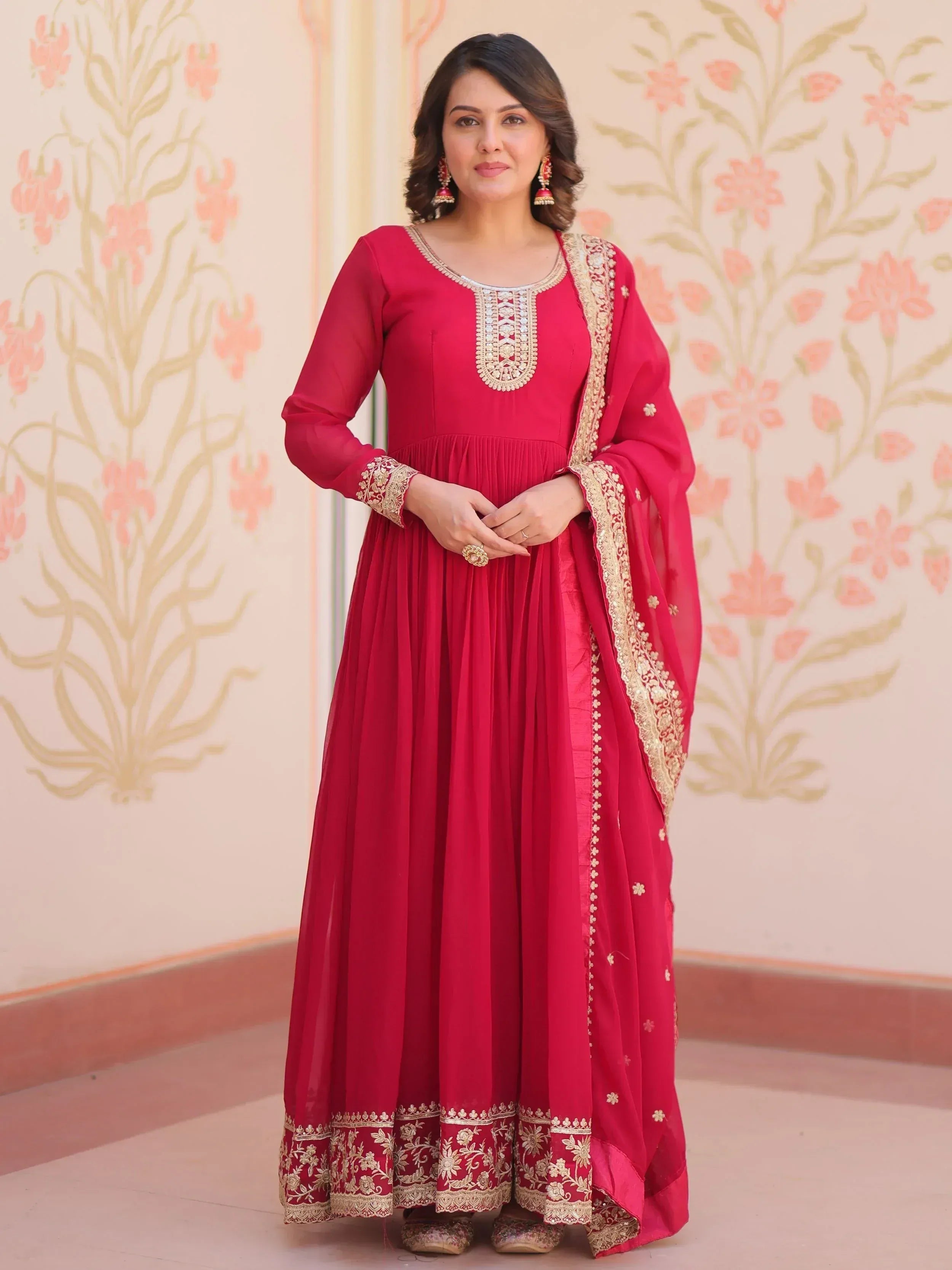 Red ethnic anarkali gown with gold embroidery, perfect for Indian weddings and festive occasions